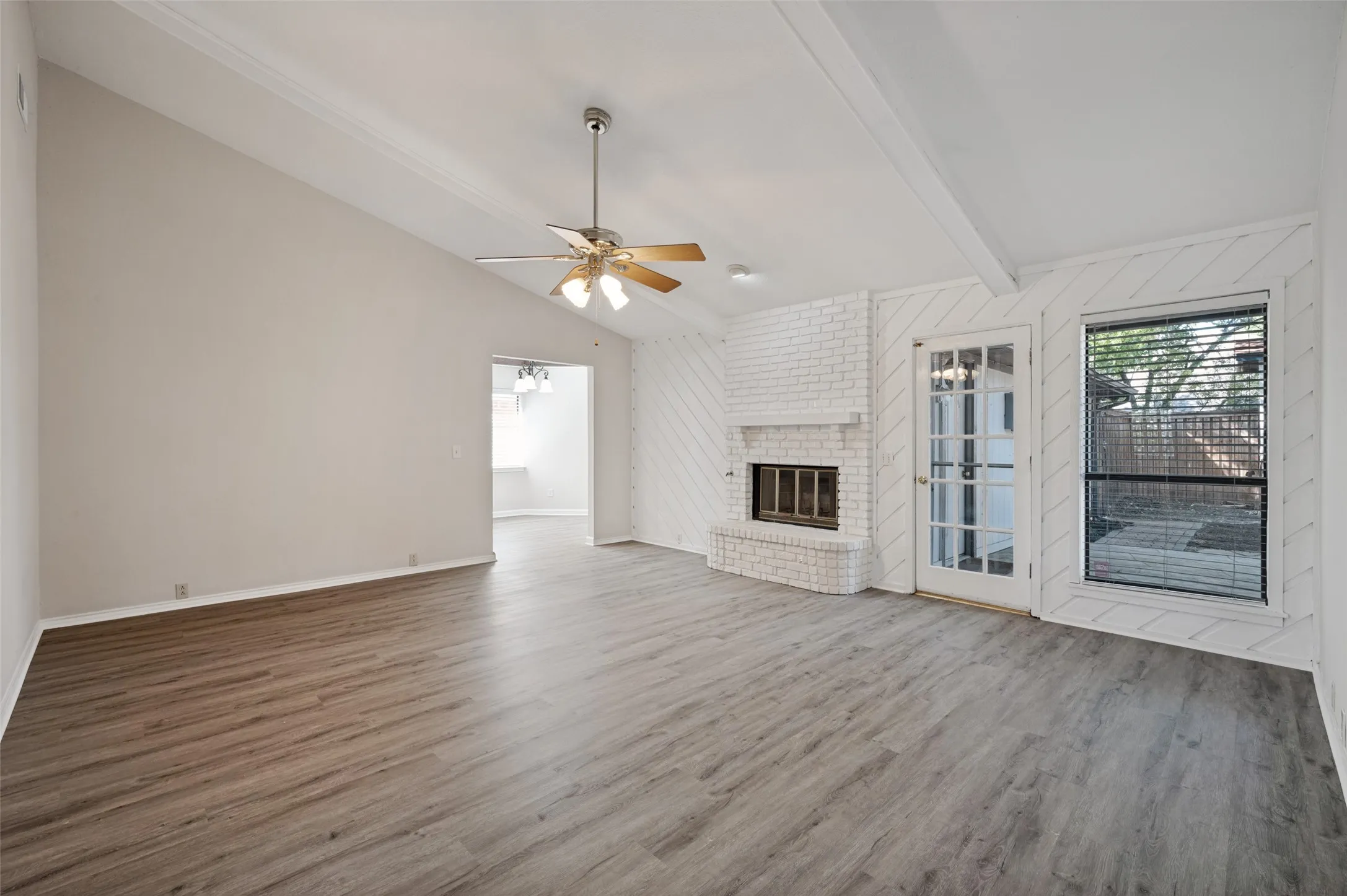 Family Room with Fireplace and Backyard Views