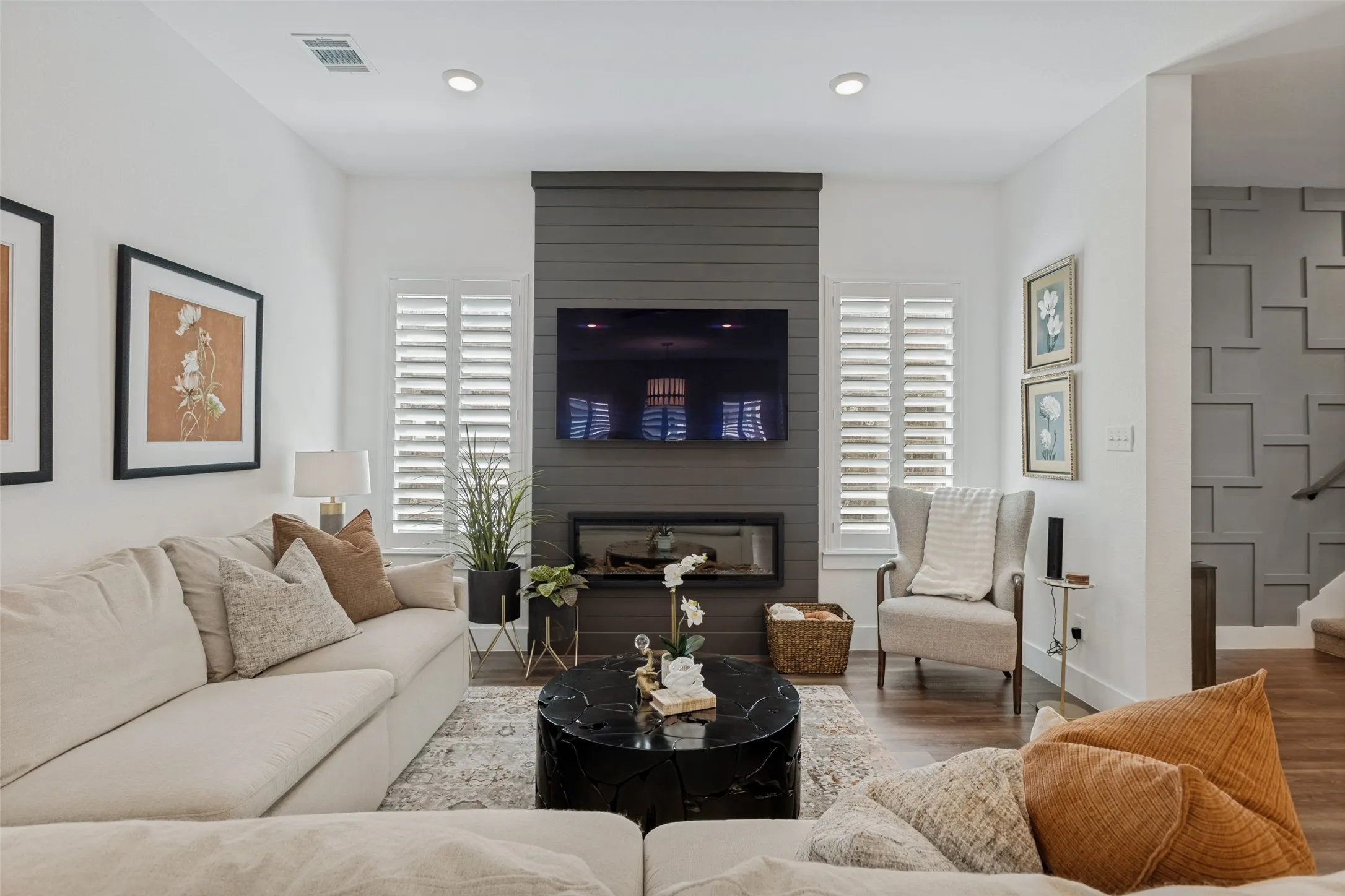 Custom electric fireplace and accent wall in the main living room