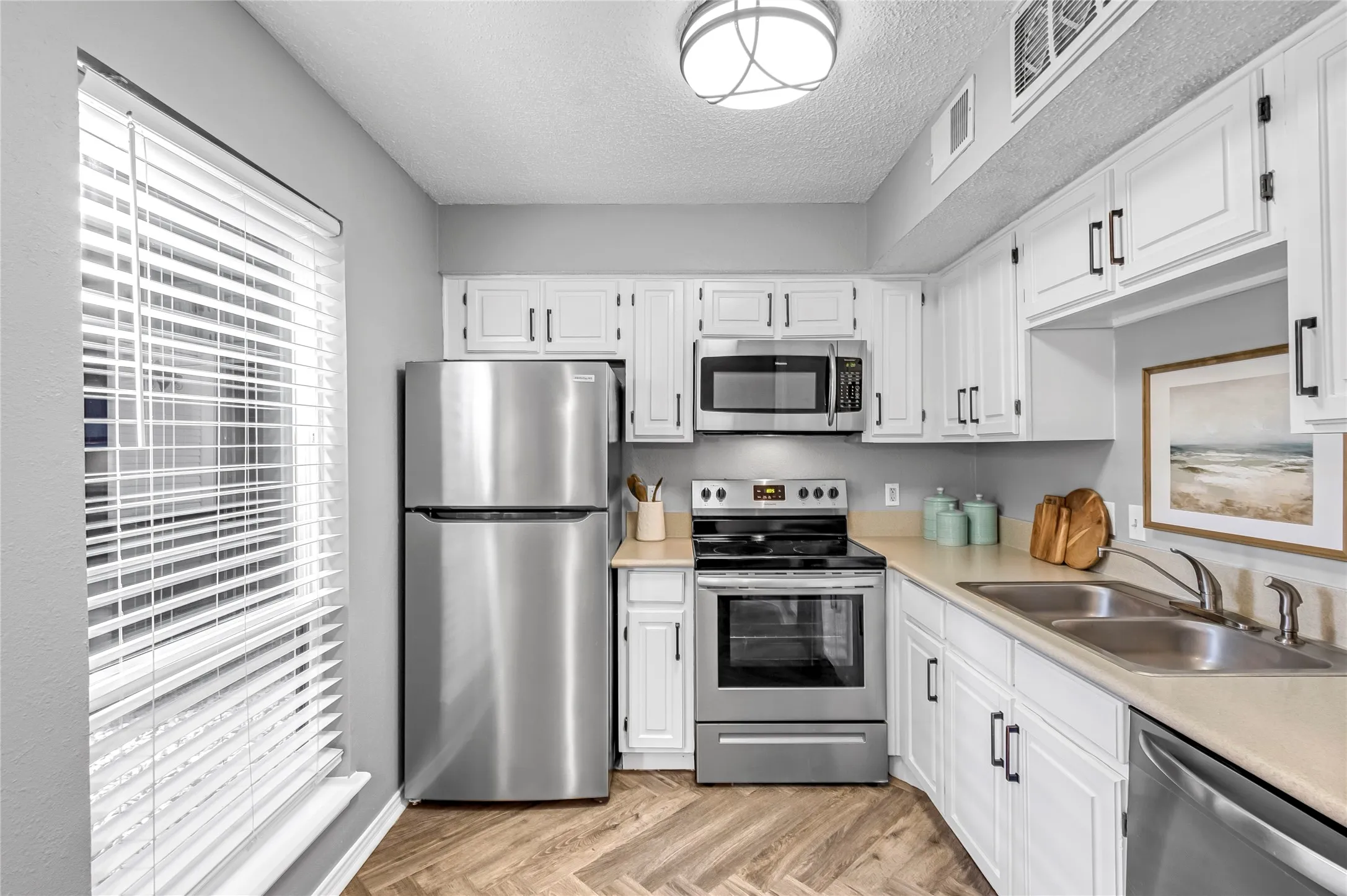 Freshly painted white kitchen cabinets.