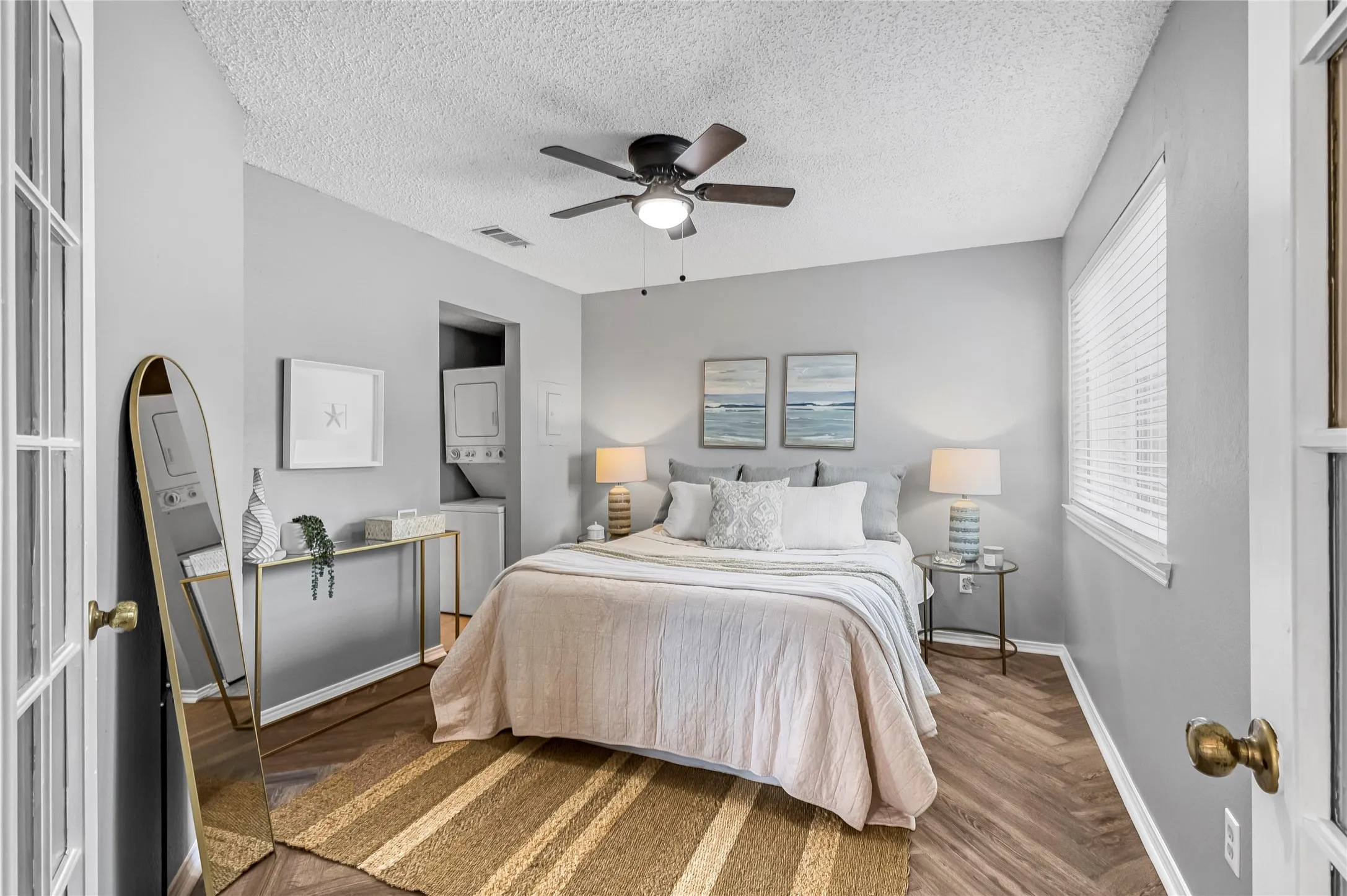 Bedroom with ceiling fan and ensuite bath.