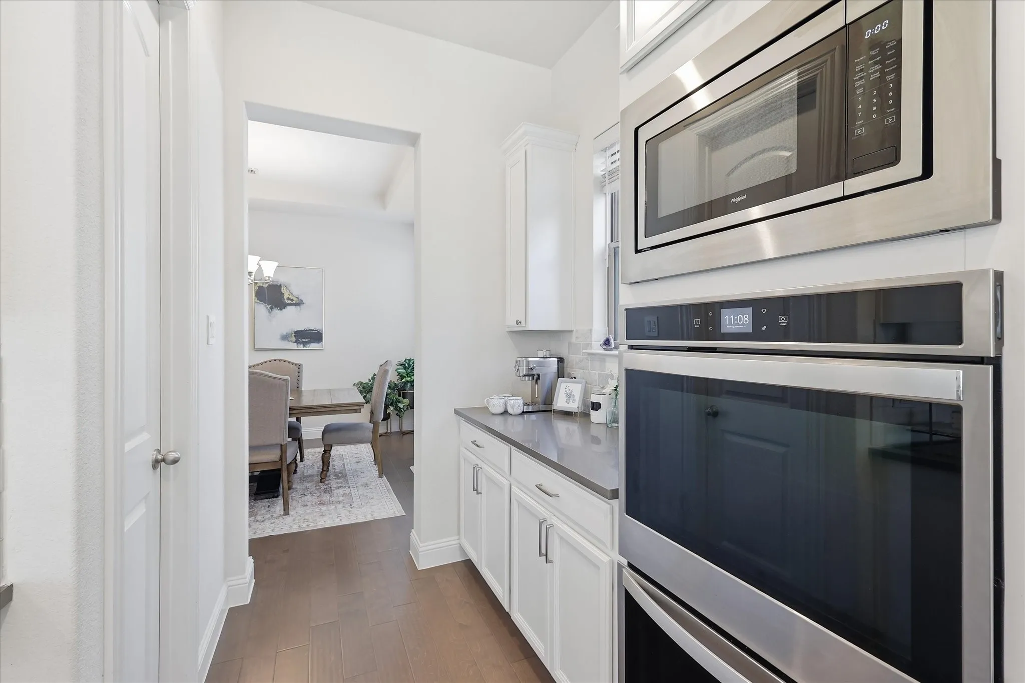 Stainless steel appliances and double ovens.