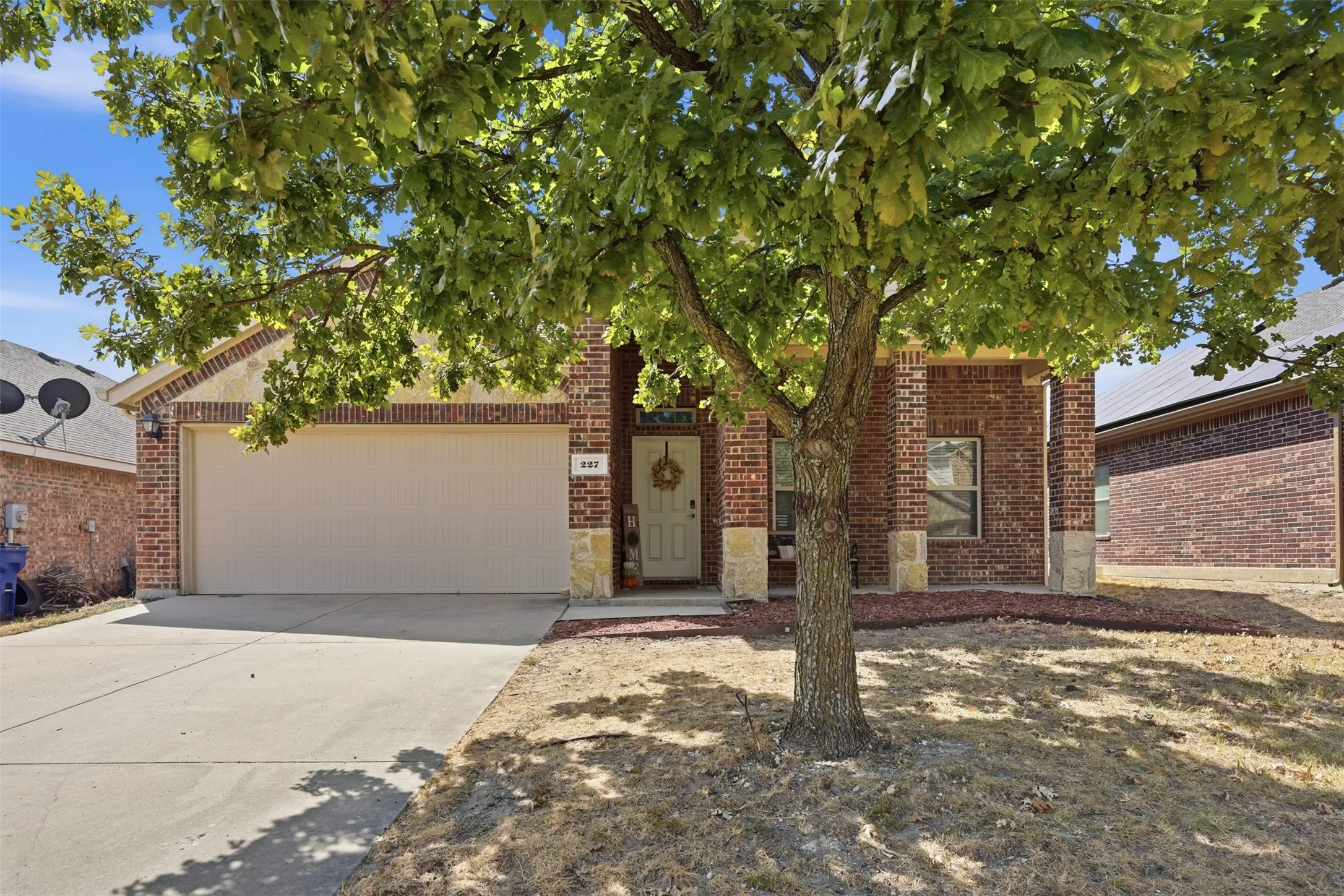 This spacious Waxahachie home offers approximately 2,164 square feet, 4 bedrooms, 2.5 bathrooms, and a functional two-story floor plan