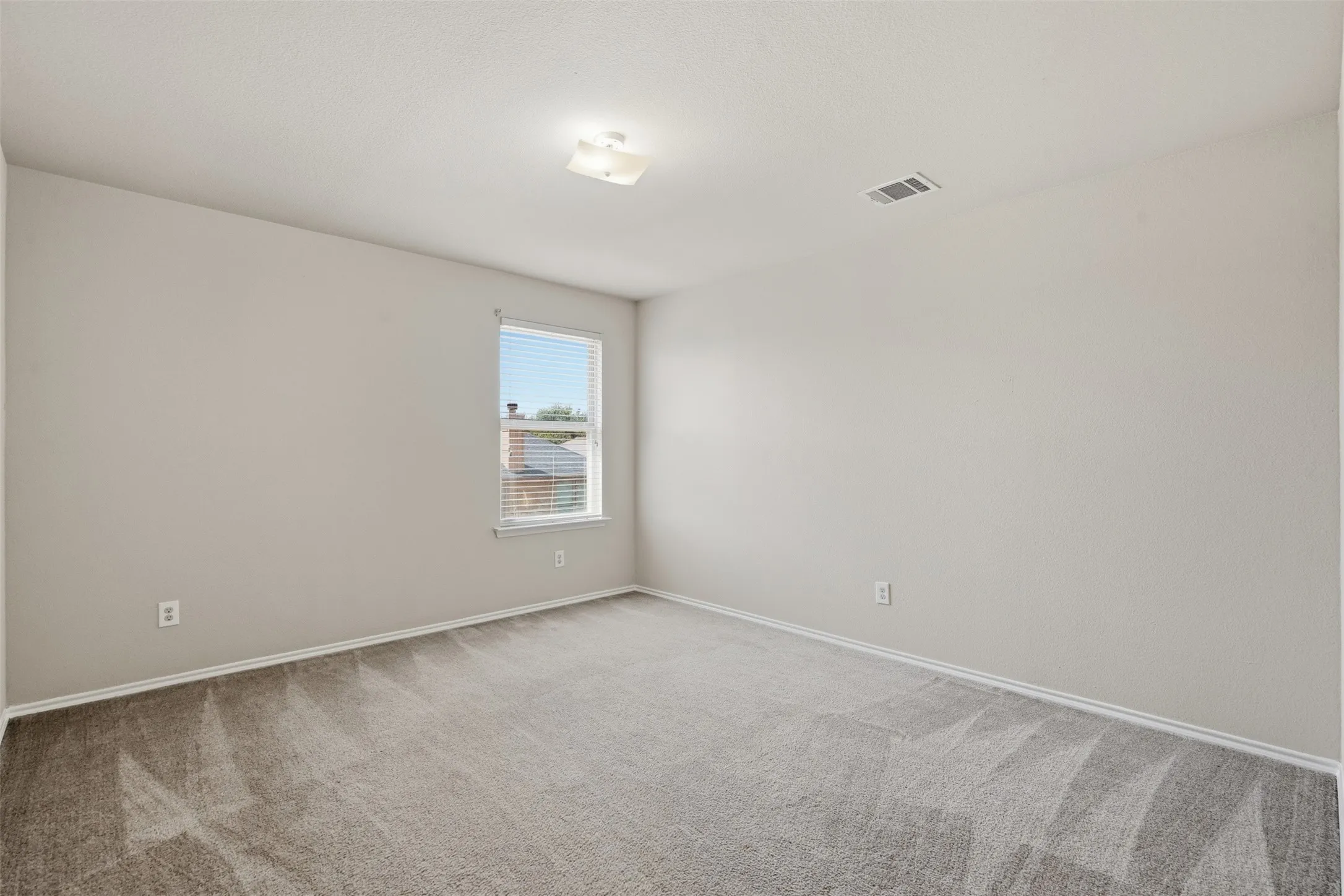 One of three upstairs secondary bedrooms, offering flexible space for children, guests, hobbies, or a home office