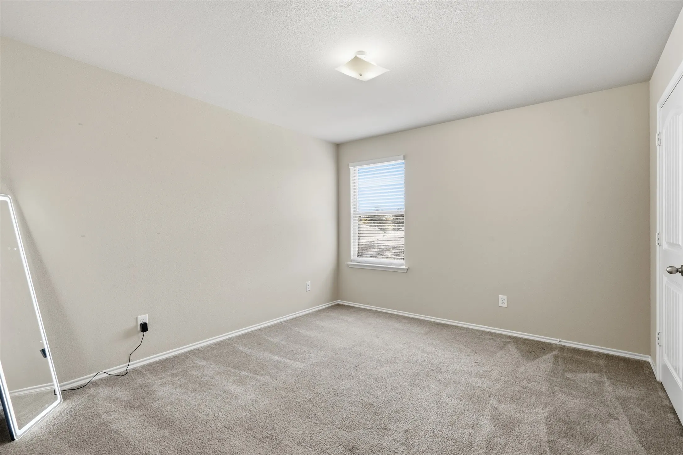 Spacious secondary bedroom offering flexibility for family, guests, hobbies, or a home office in this 4-bedroom Waxahachie home