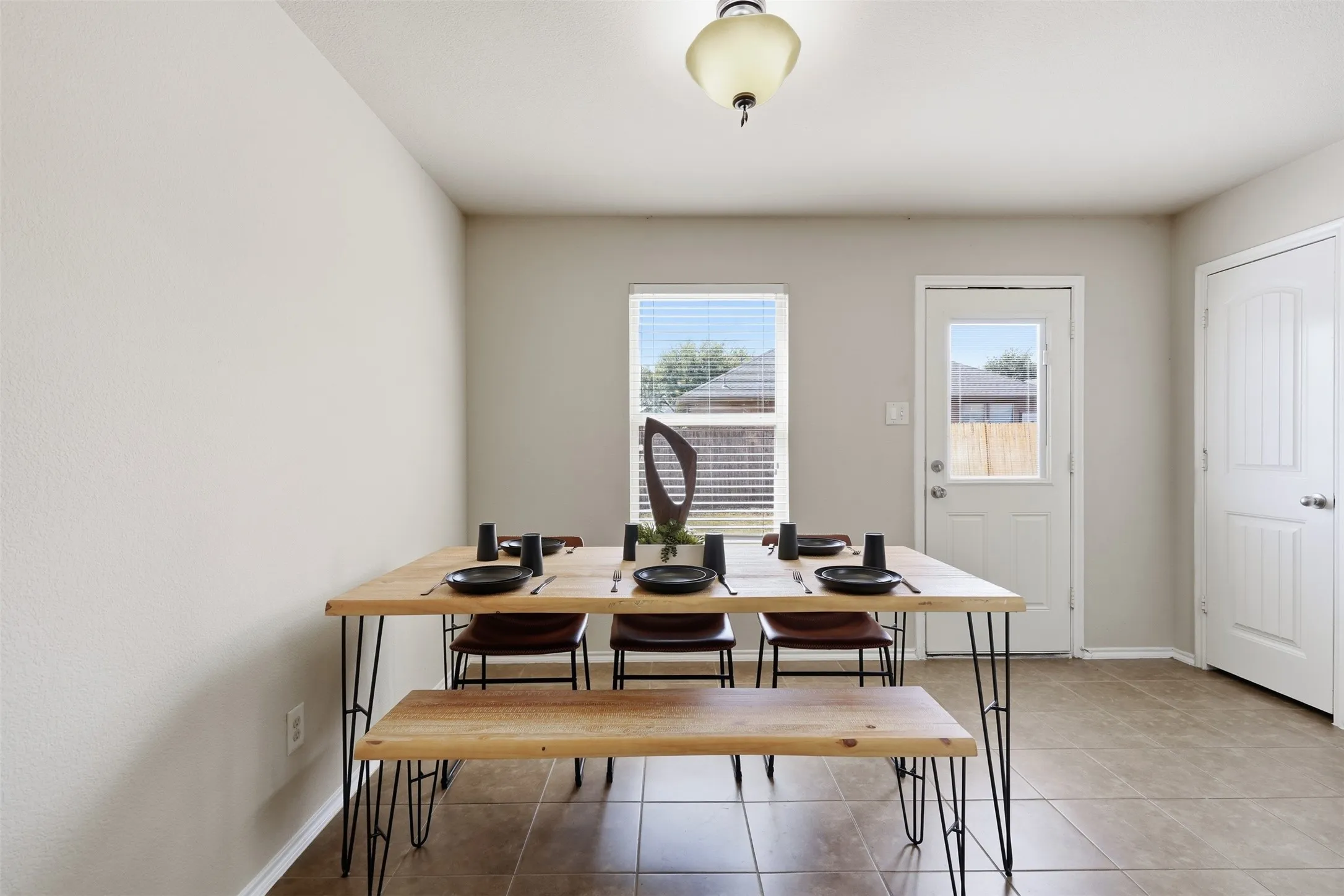 The private downstairs primary suite offers convenience, privacy, and space to create a relaxing retreat