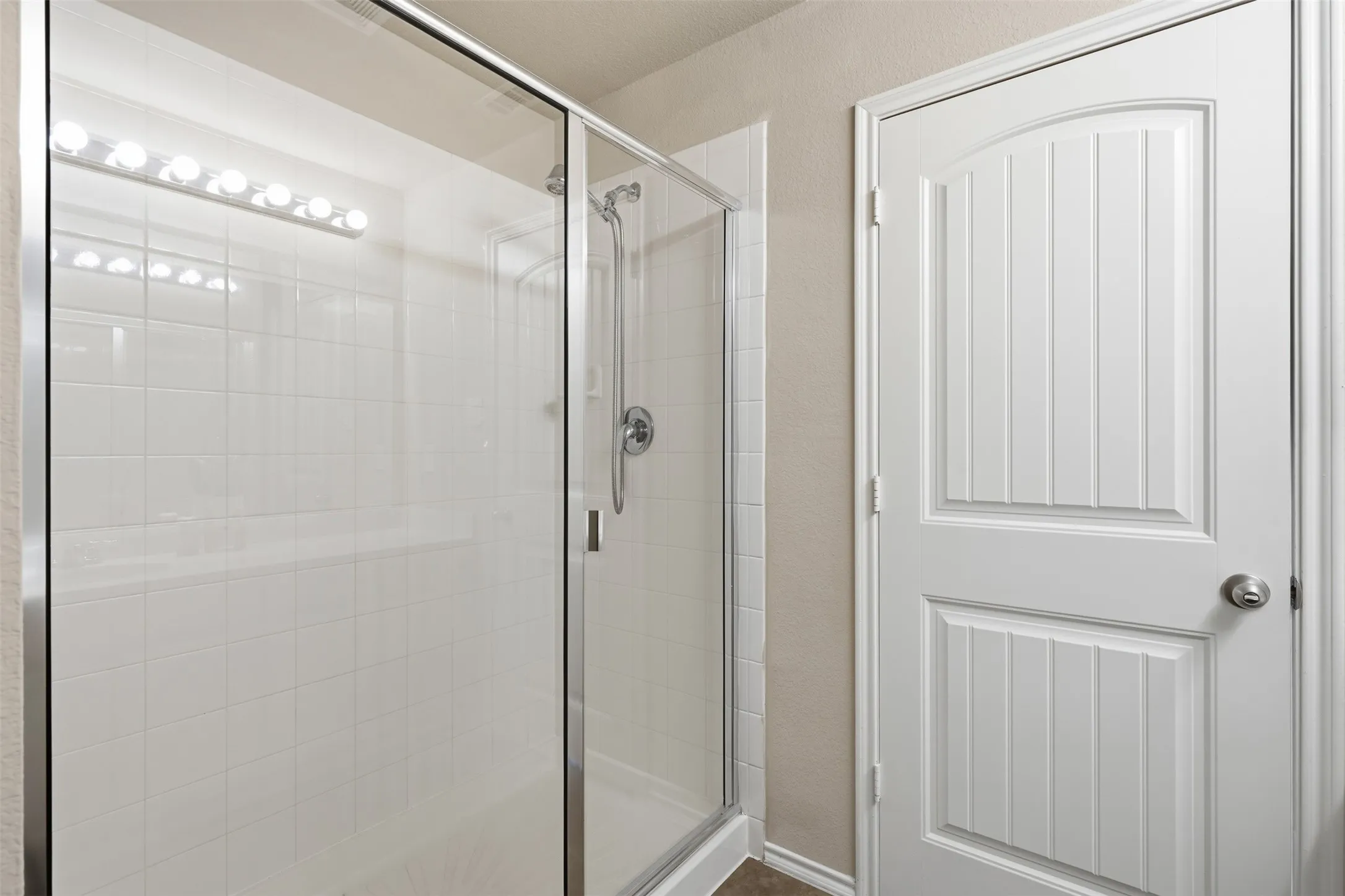 The primary bathroom provides a functional space for preparing for the day or unwinding at home