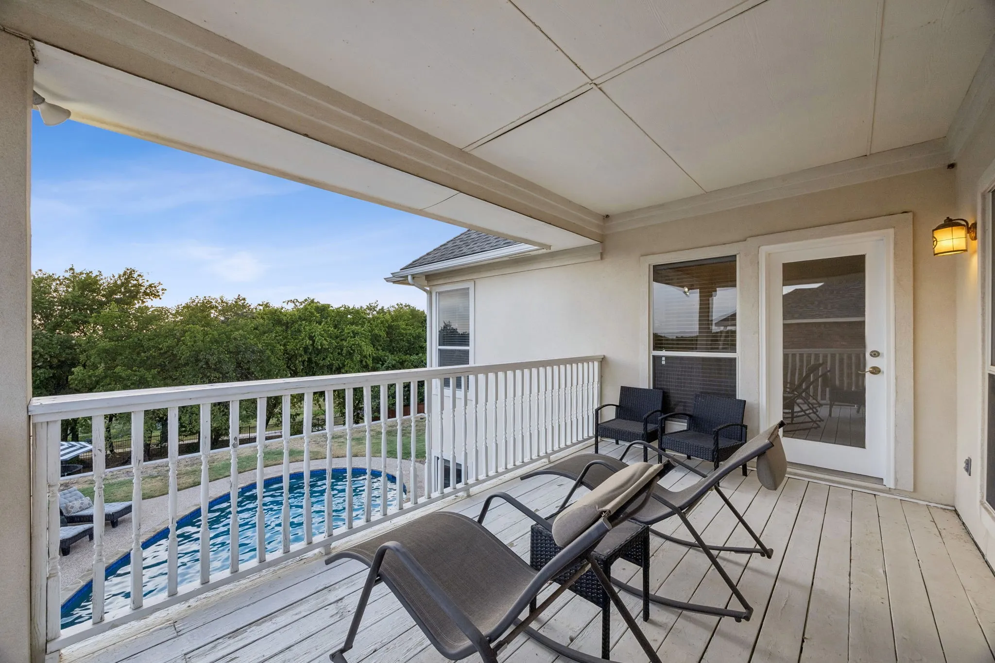 Balcony overlooking pool and golf