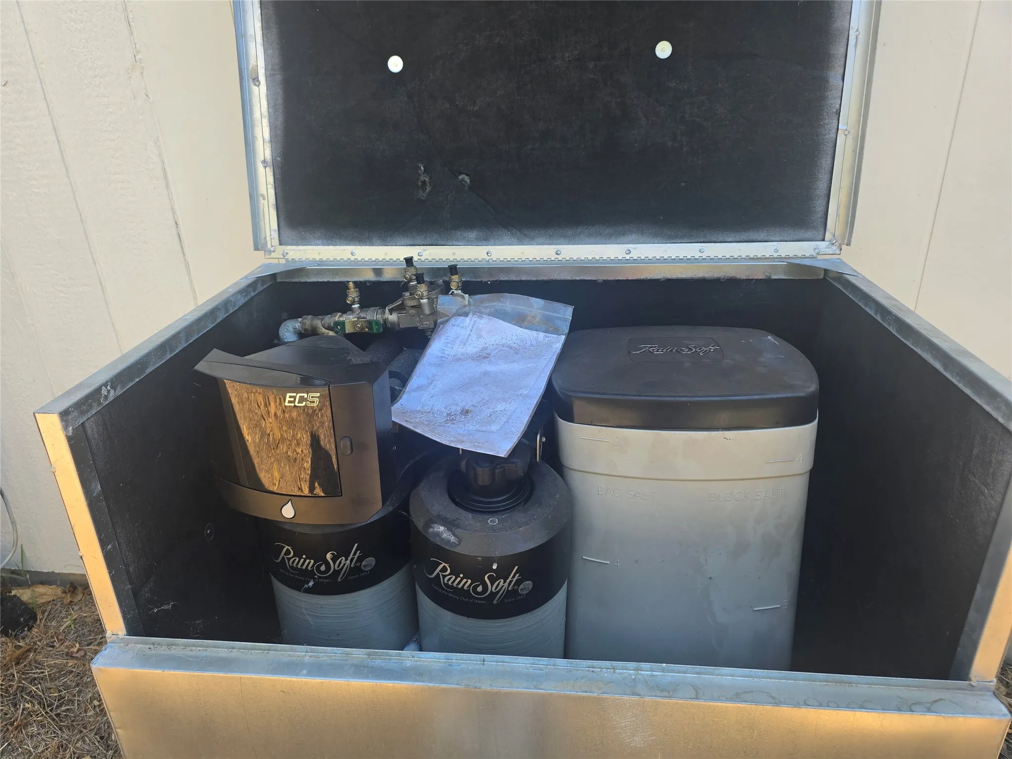 Rain Soft water treatment system enclosed in a protective housing