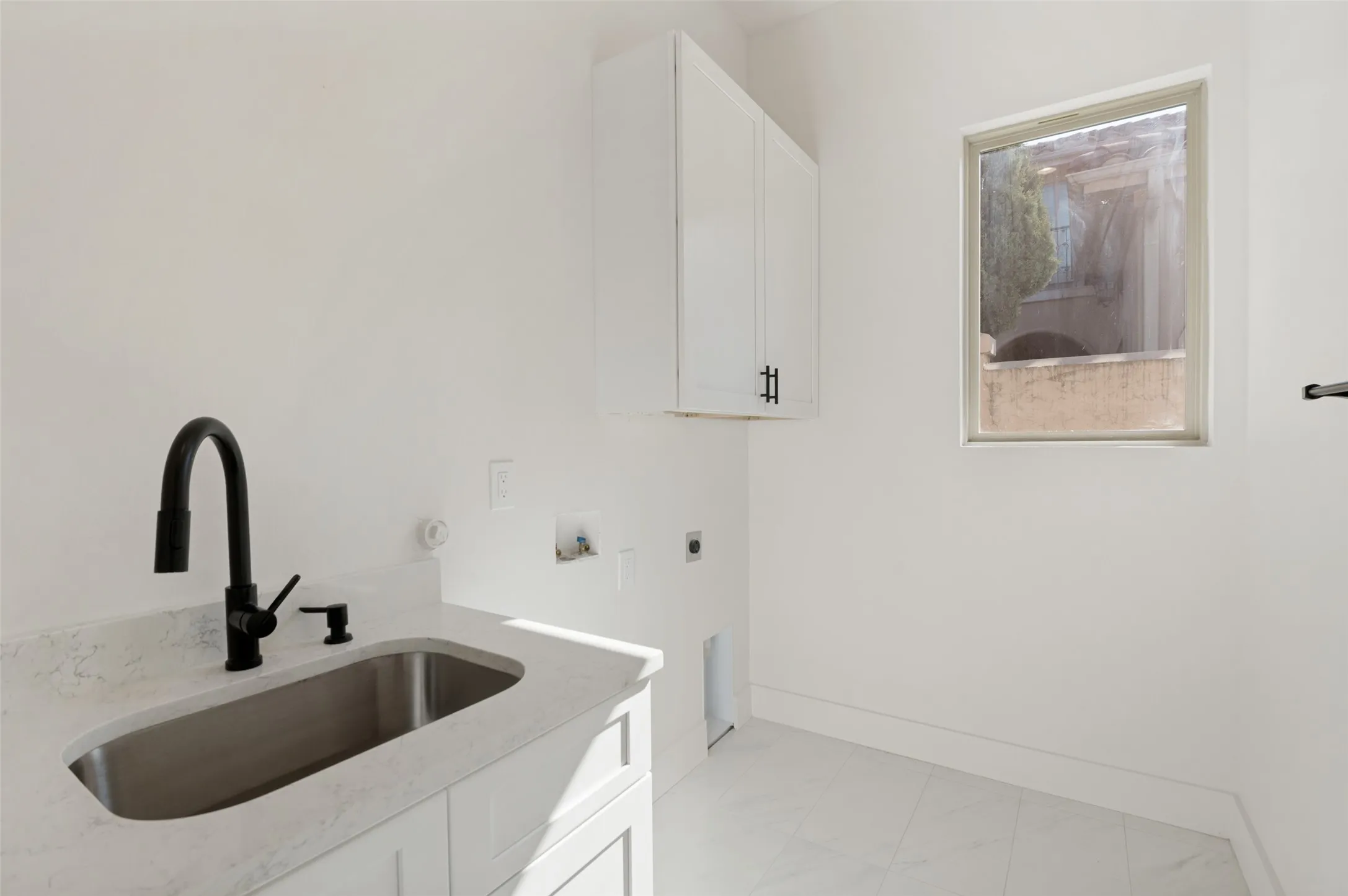 spacious laundry room with washer and dryer hookups