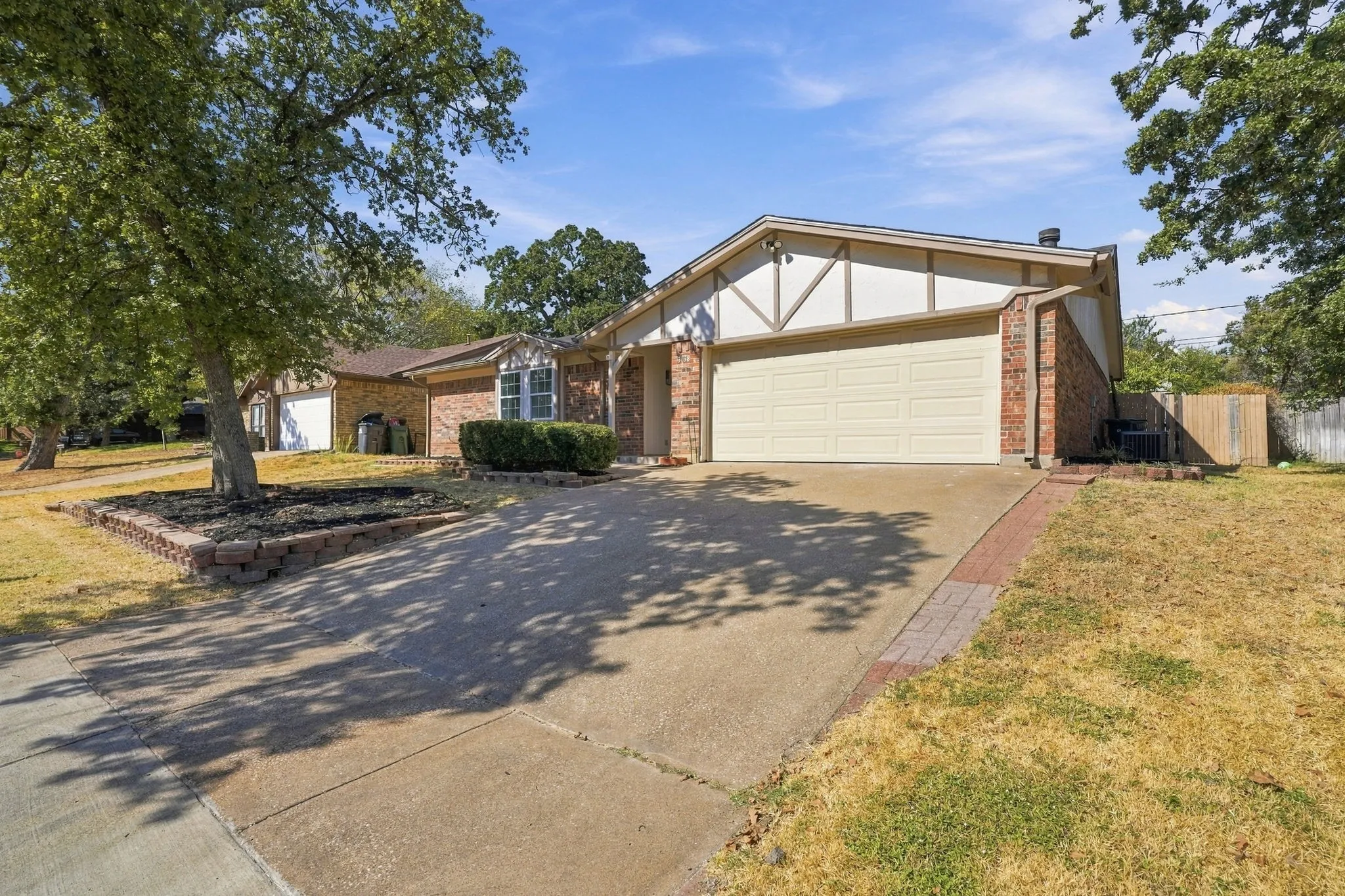 Brick and siding exterior with a two-car garage