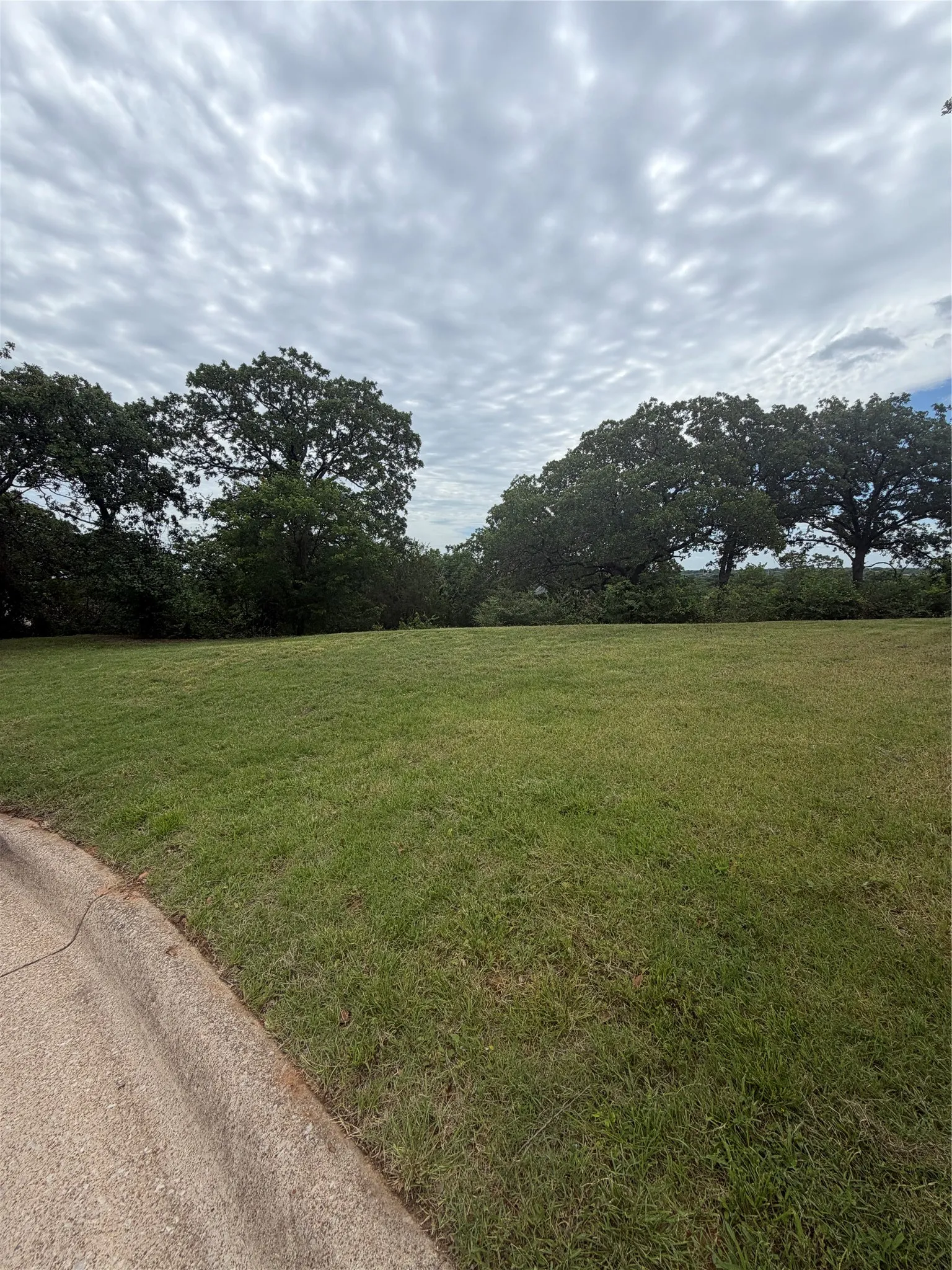 Left side of lot from curb 6704 Nob Hill Court