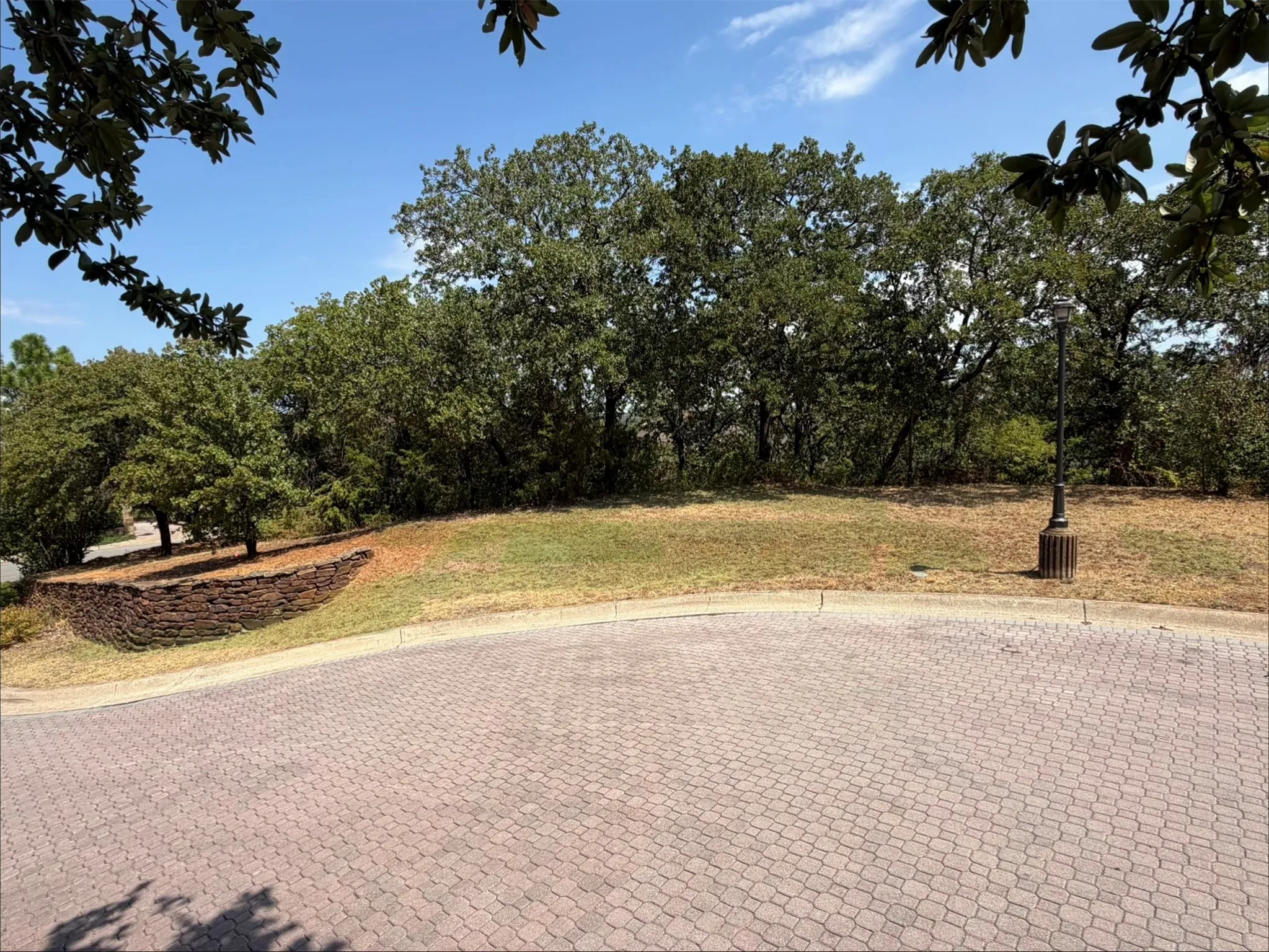 66708 Nob Hill Court corner lot in cul-de sac with pavers,and mature trees