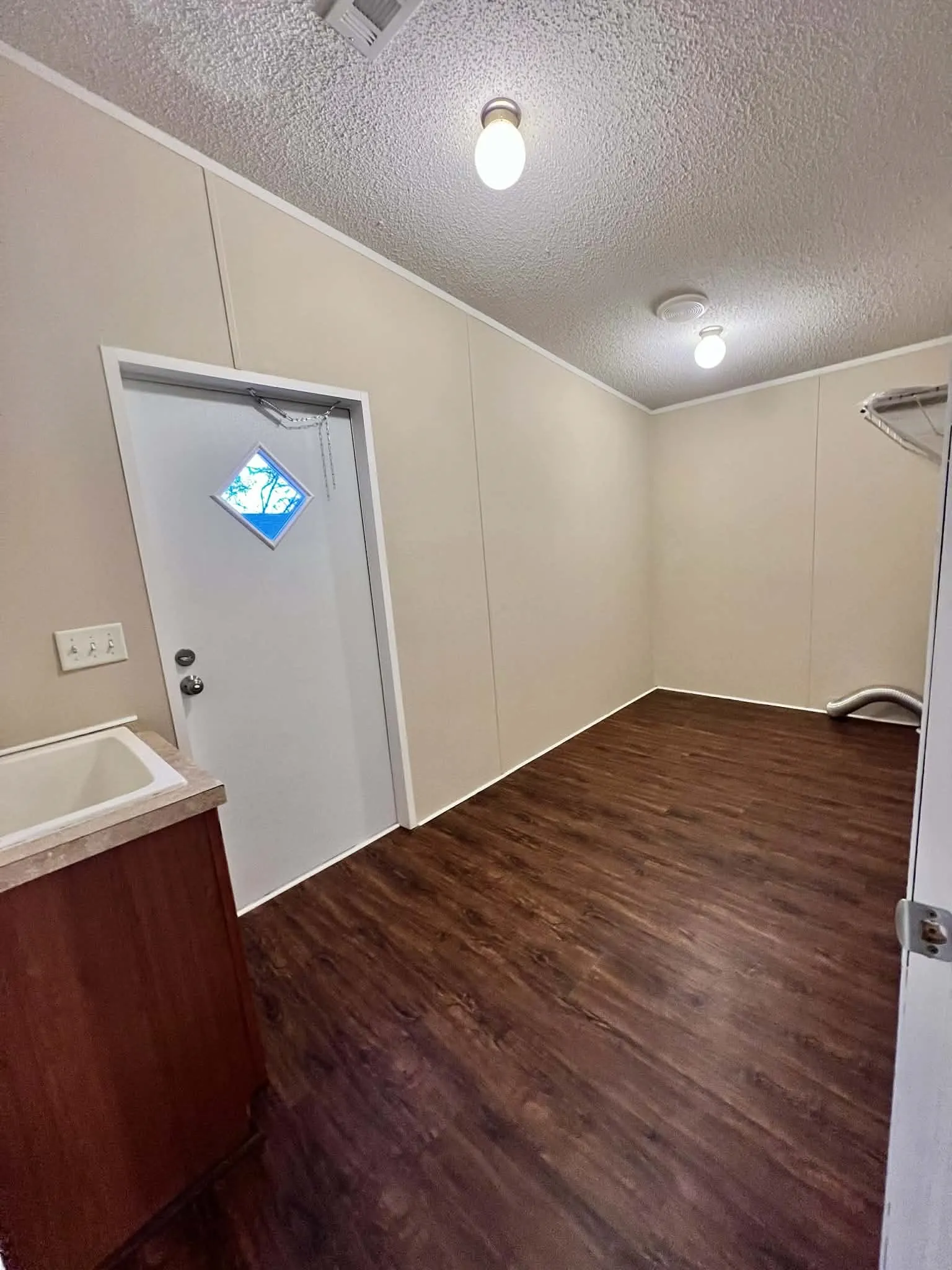 laundry room with sink and plenty of room for freezer!