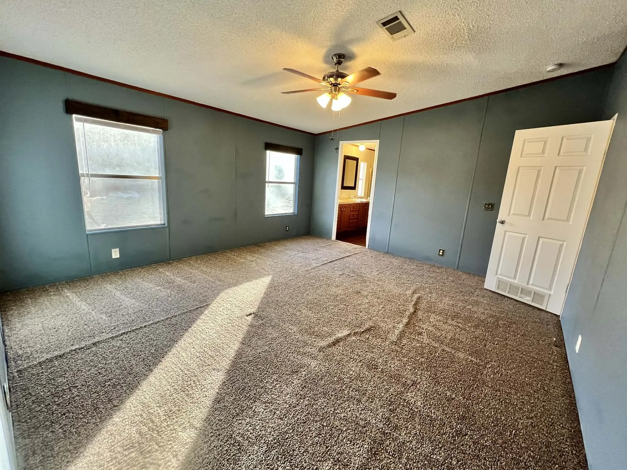 spacious primary bedroom with ensuite bath