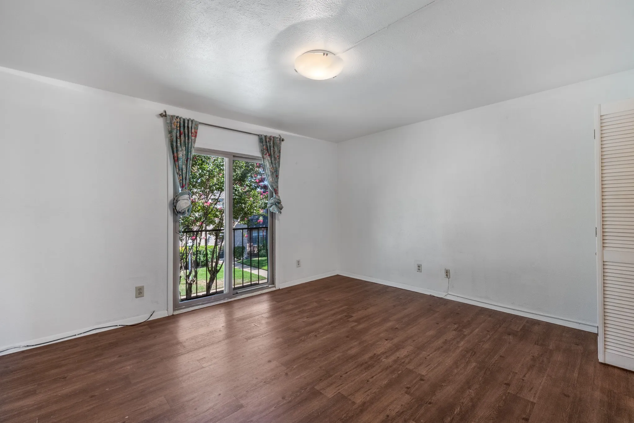 Wood-finish flooring with white walls