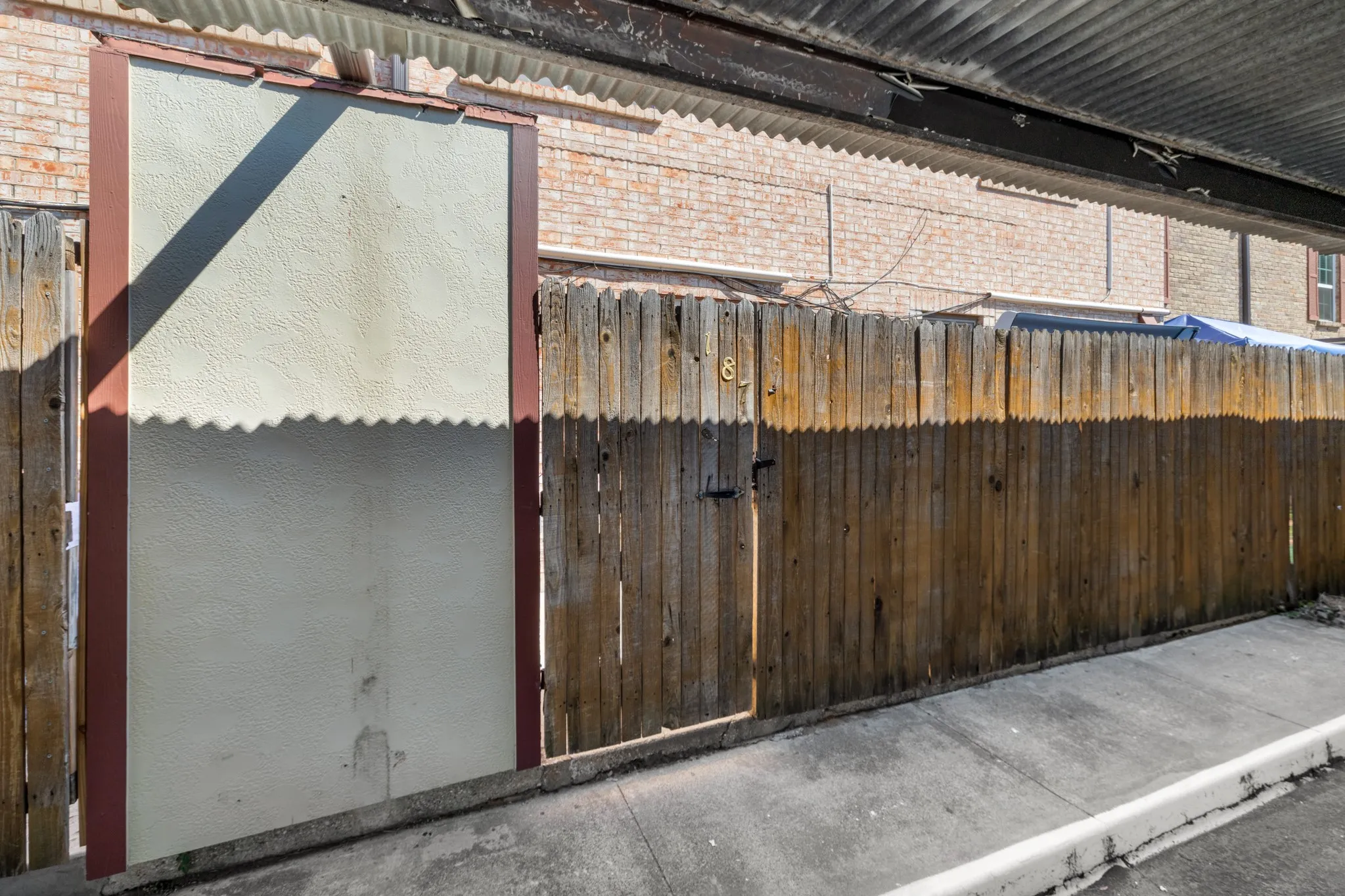 Wood privacy fence with metal latch