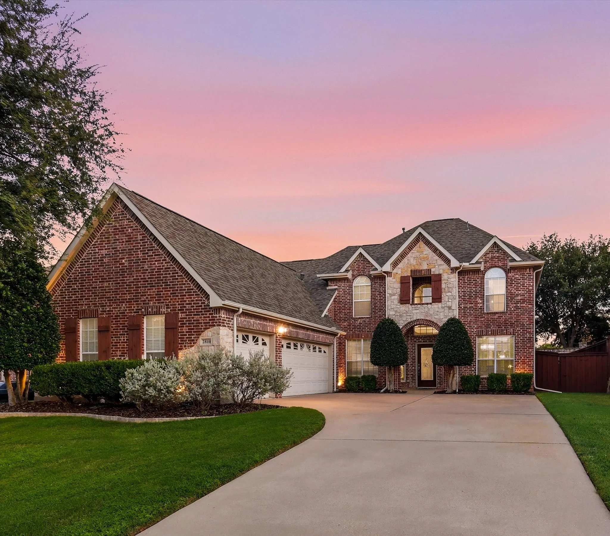 Brick and stone exterior featuring multiple gables