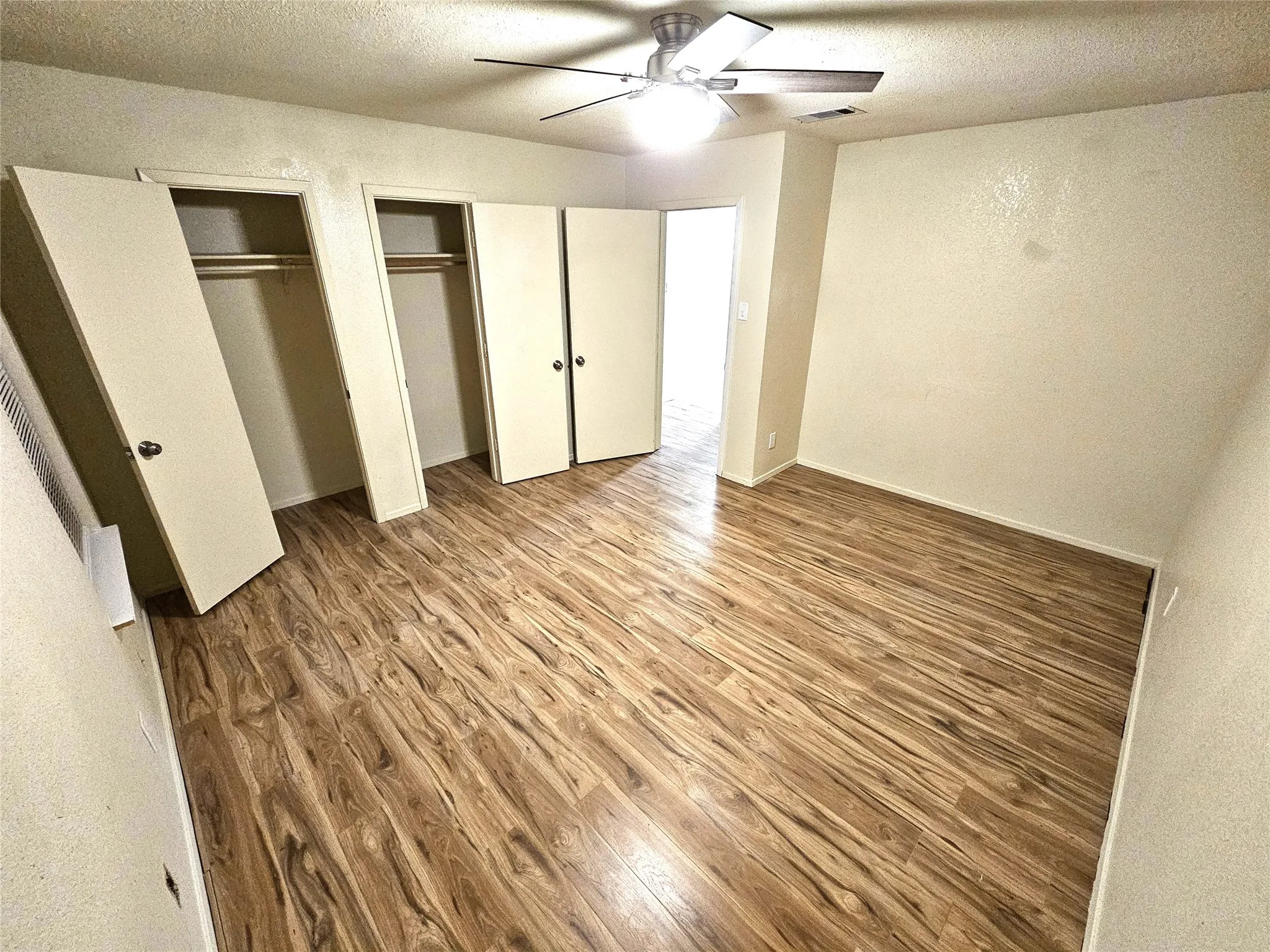 Bedroom#2-Another good size bedroom (13x13) with new ceiling fan & new wood laminate floor. And with double closets as well. (unit B)