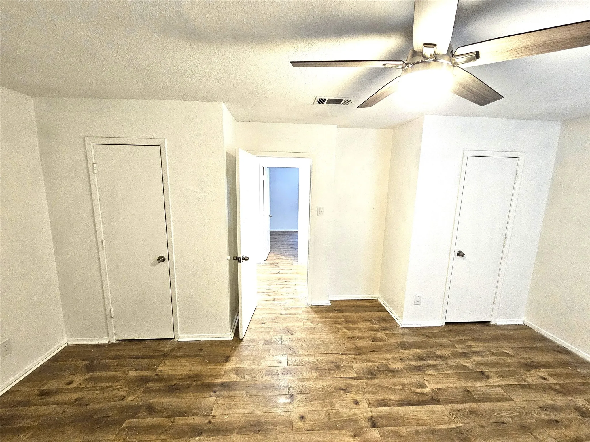 Bedroom#2-Another good size bedroom (13x13) with new ceiling fan & new wood laminate floor. And with double closets as well. (unit A)