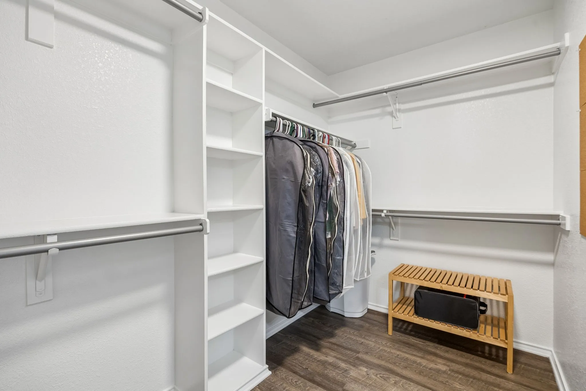 Generous walk-in closet with built ins and ample hanging space