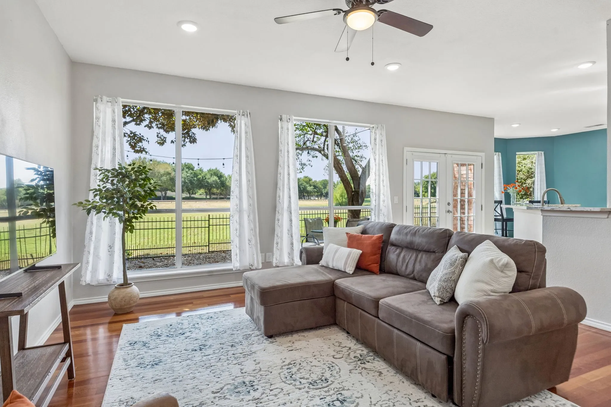 Banks of windows allow great views of golf course & pond