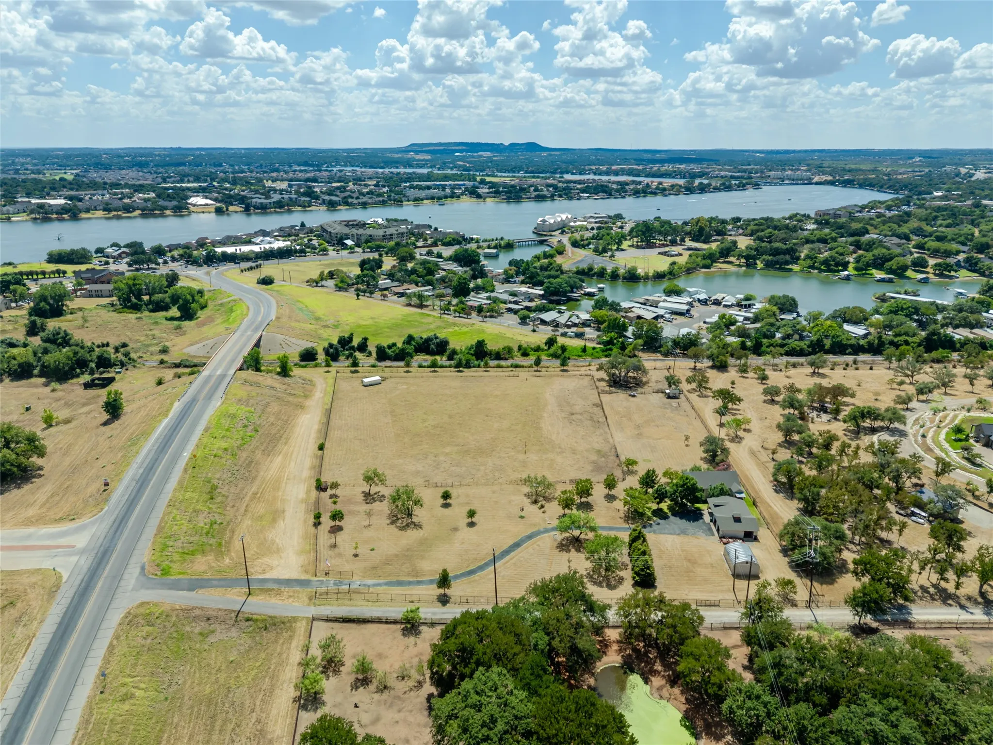 Expansive land parcel with surrounding waterways, including a prominent lake
