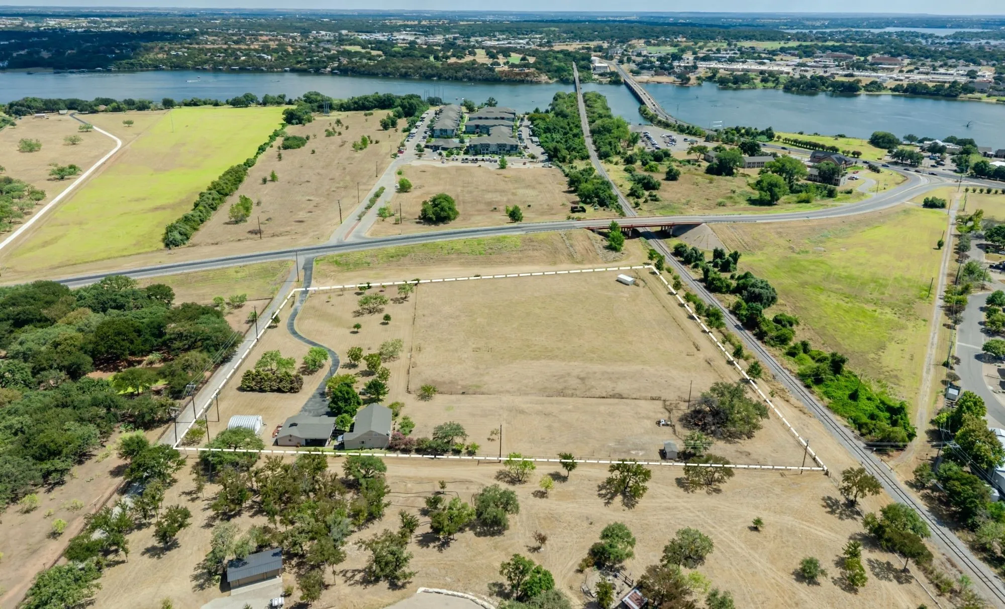 Expansive acreage featuring a single-story residence and mature trees