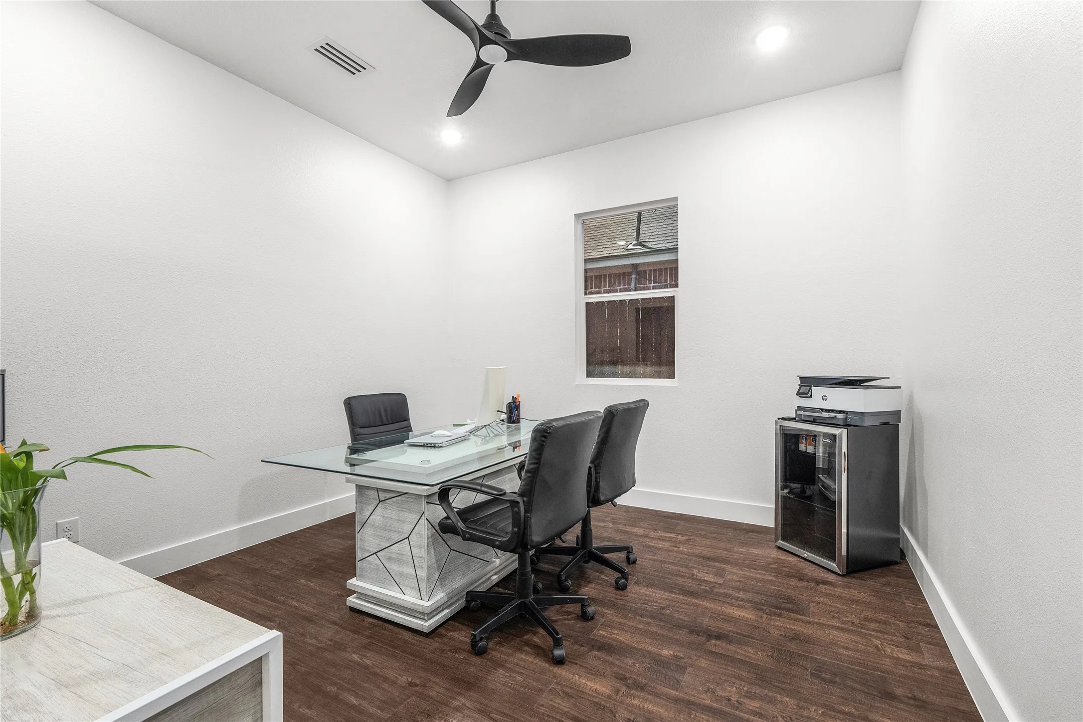 Wood-finish flooring, recessed lighting, and a ceiling fan