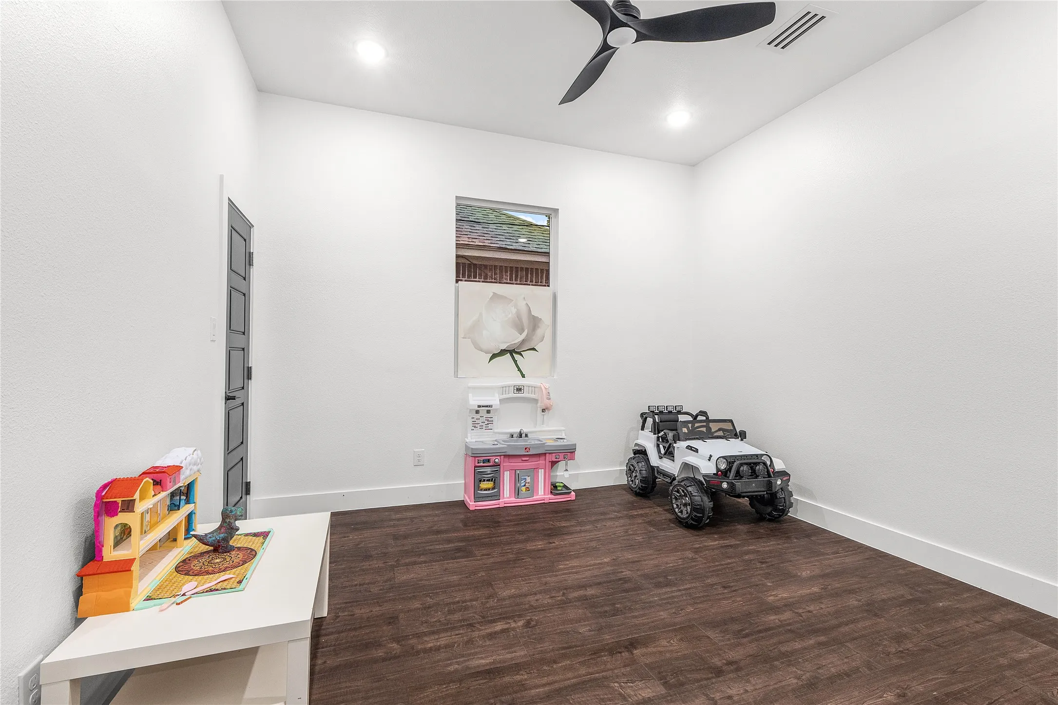 Wood-finish flooring, recessed lighting, and a ceiling fan