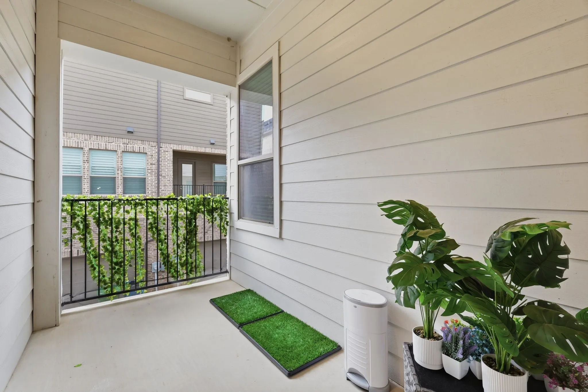 What a cozy balcony to have coffee and converse with your four legged family!