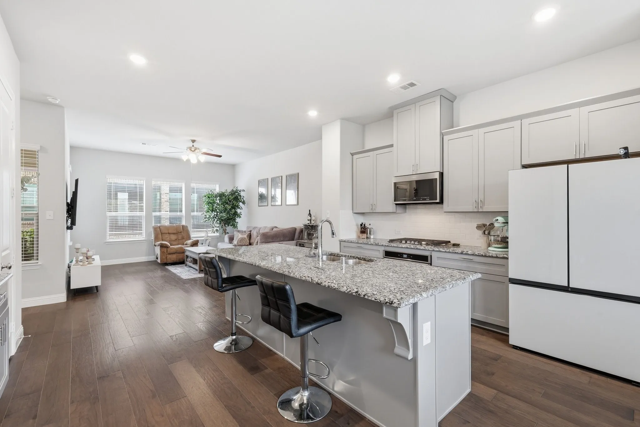 The second fantastic floor there is a Family Room, Great Kitchen AND a Breakfast Nook! This home is so flexible that there is even a 1/2 bath on this floor for your guests!