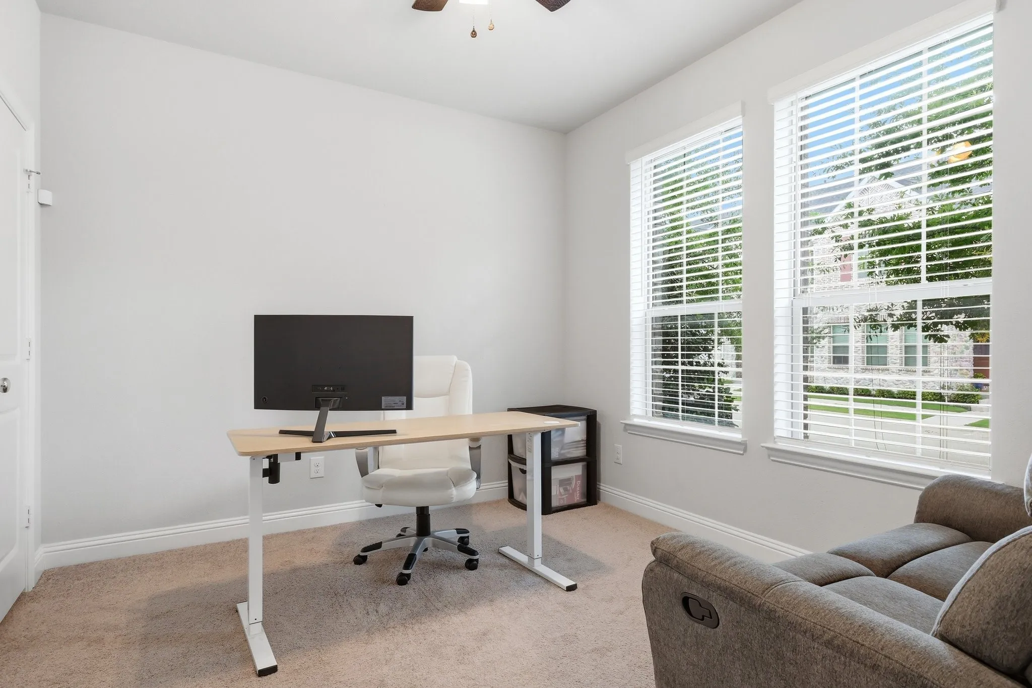 This room being used as an in office space has a closet, windows and a full bath to make it a bedroom, if you need!