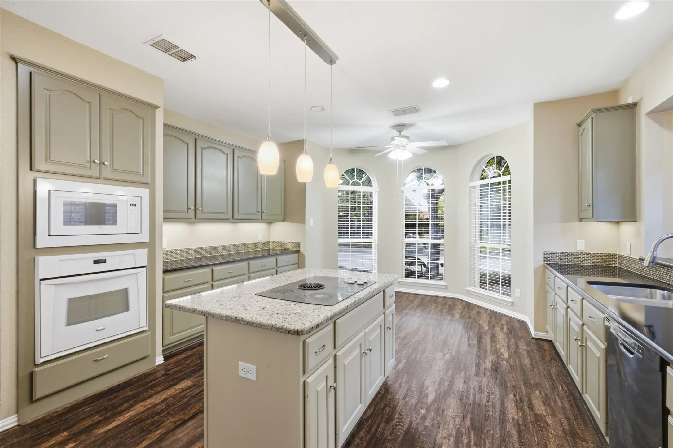 Built-in double oven plus microwave and a full prep island — holiday cooking never bottlenecks here