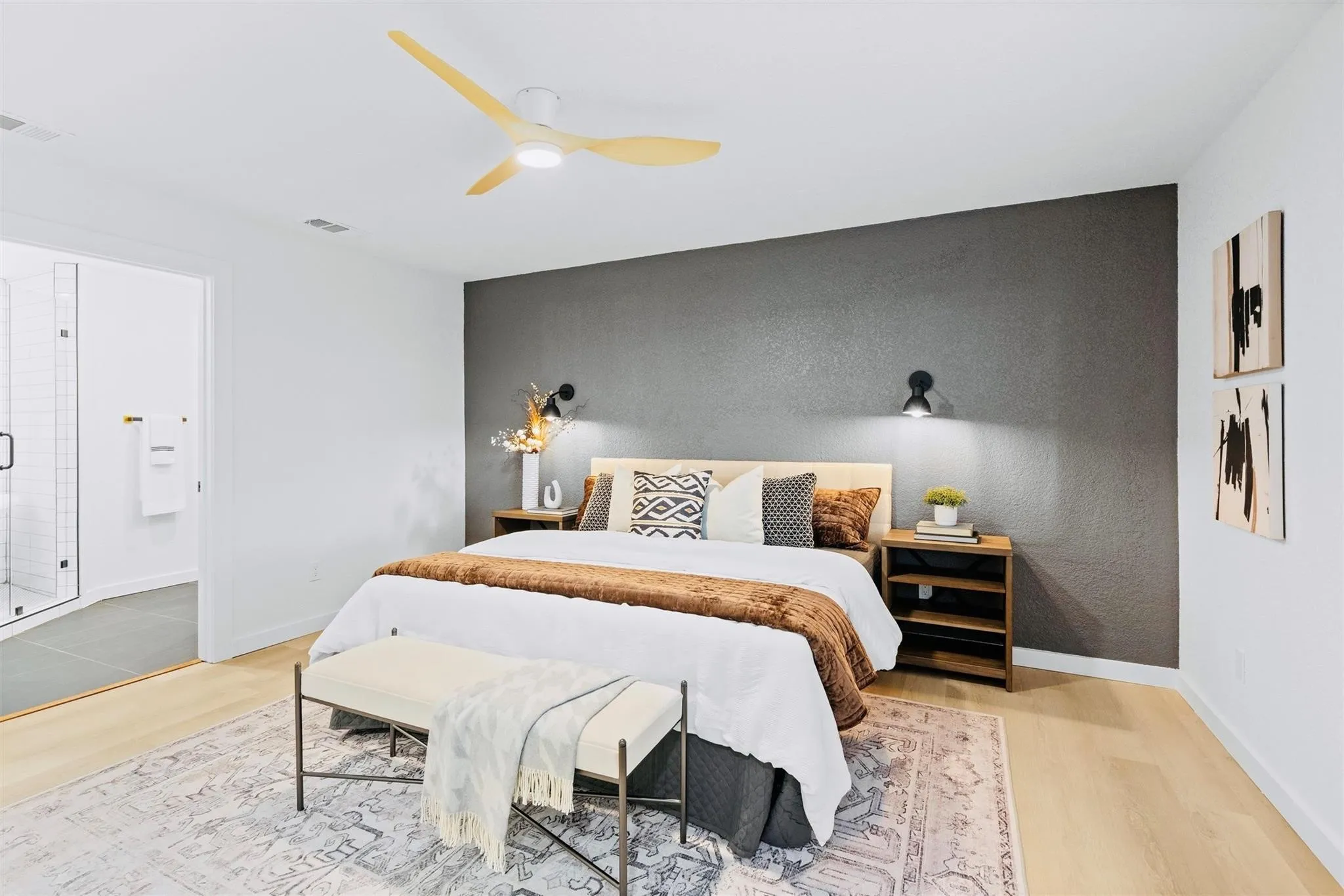 Recessed lighting, wood-finish flooring, and a modern ceiling fan with wood-tone blades