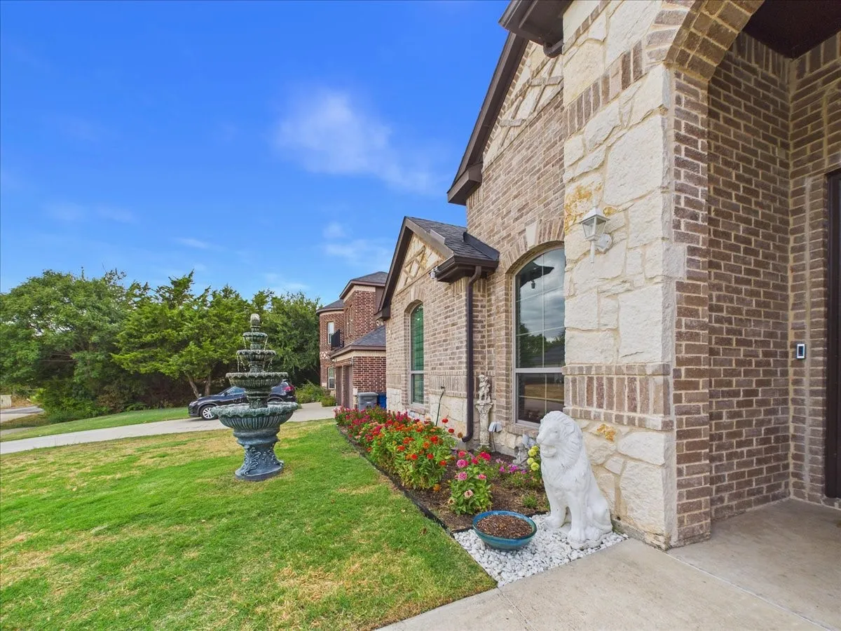 Brick and stone exterior with an arched entry