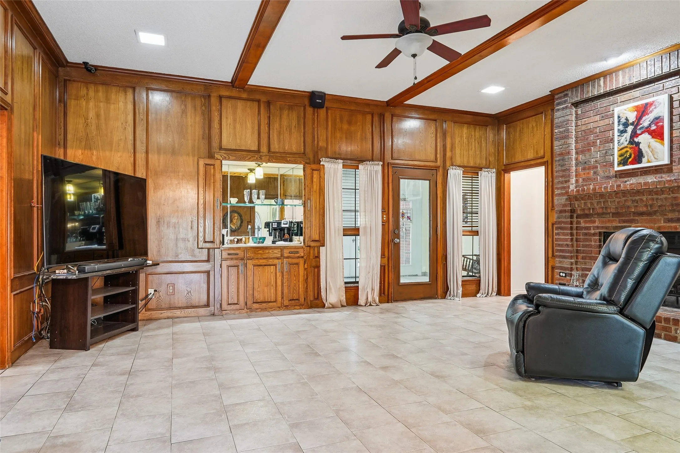 Wood paneling and exposed ceiling beams