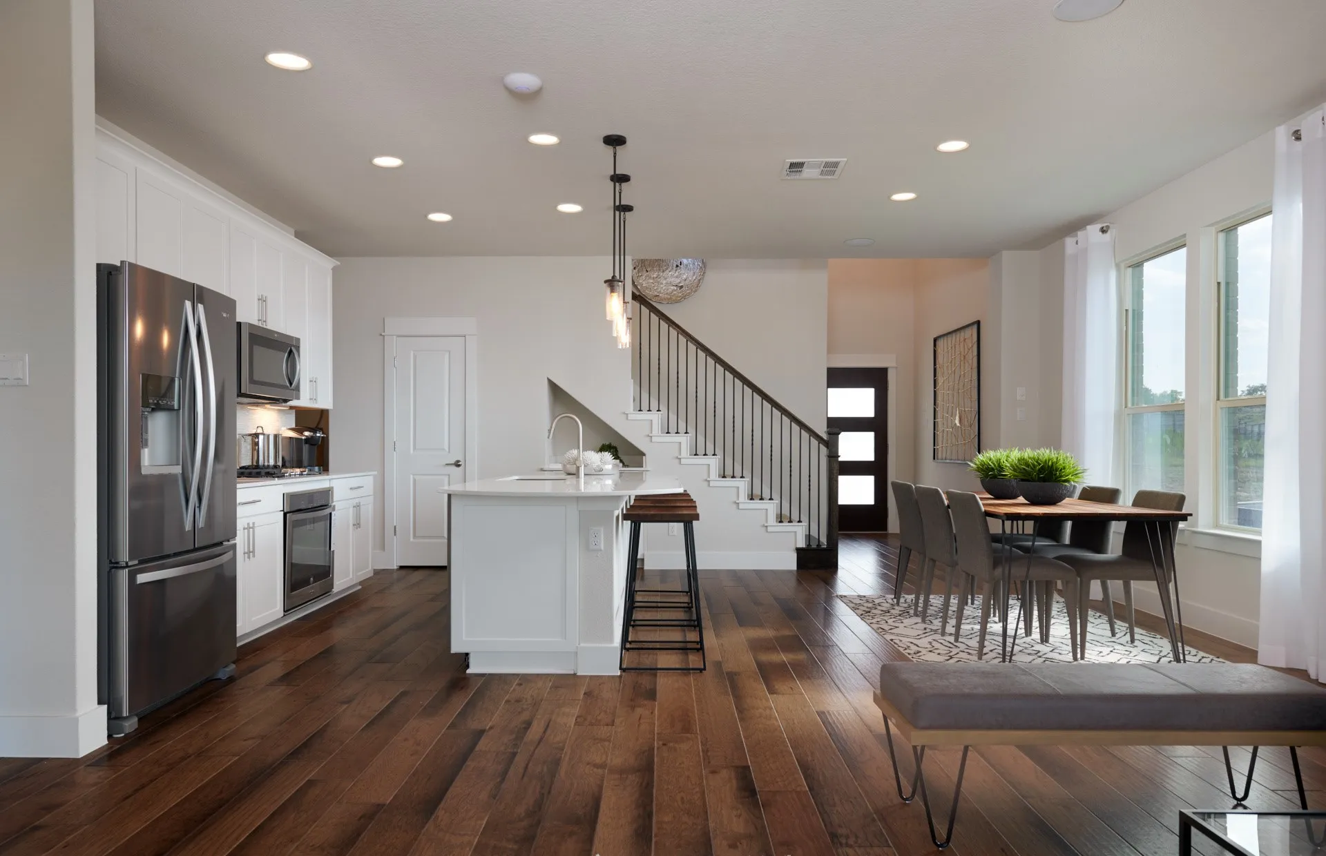 *Model Representation - Large island overlooking gathering room and dining areas