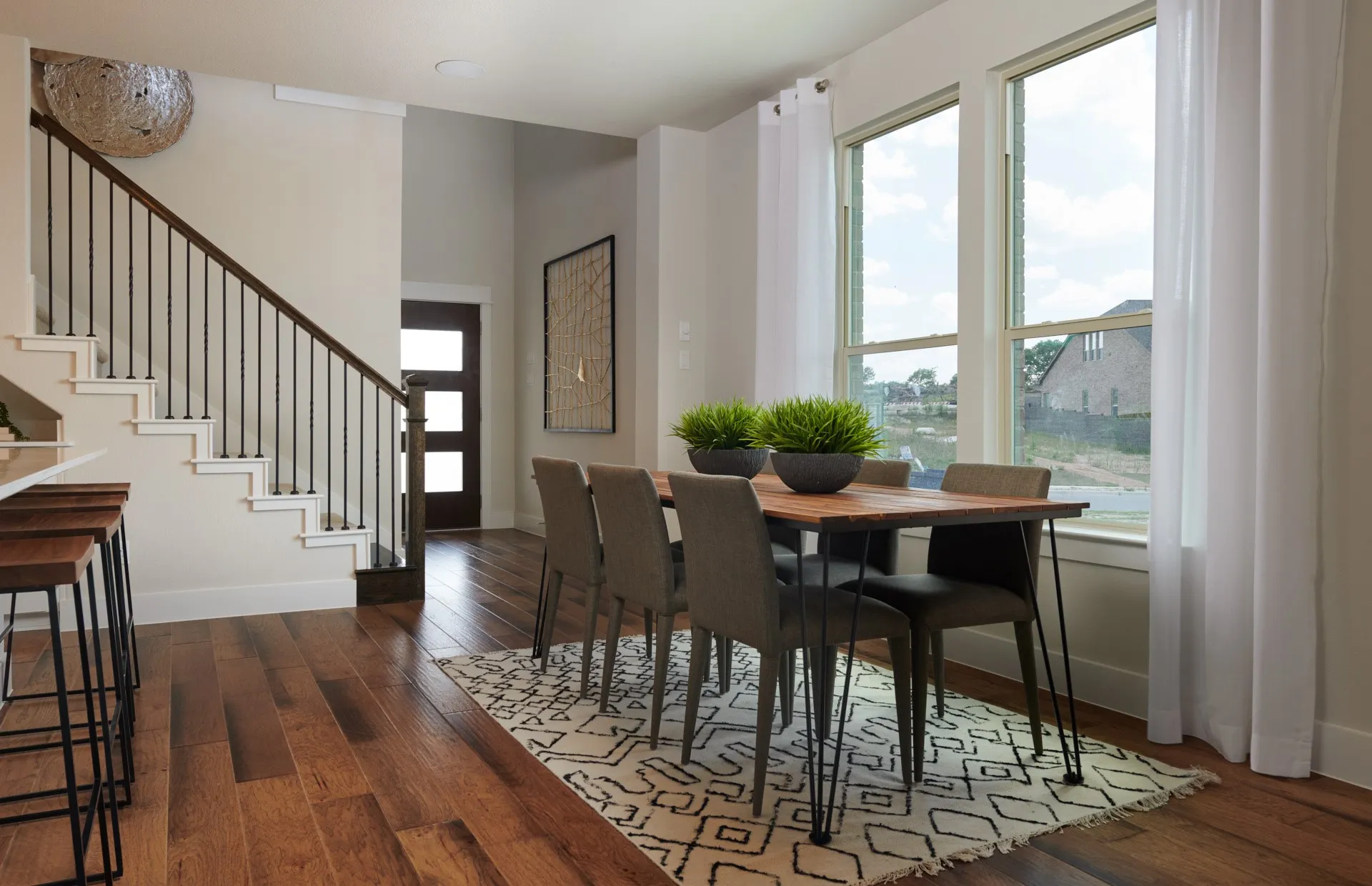 *Model Representation - Dining area off kitchen with large windows