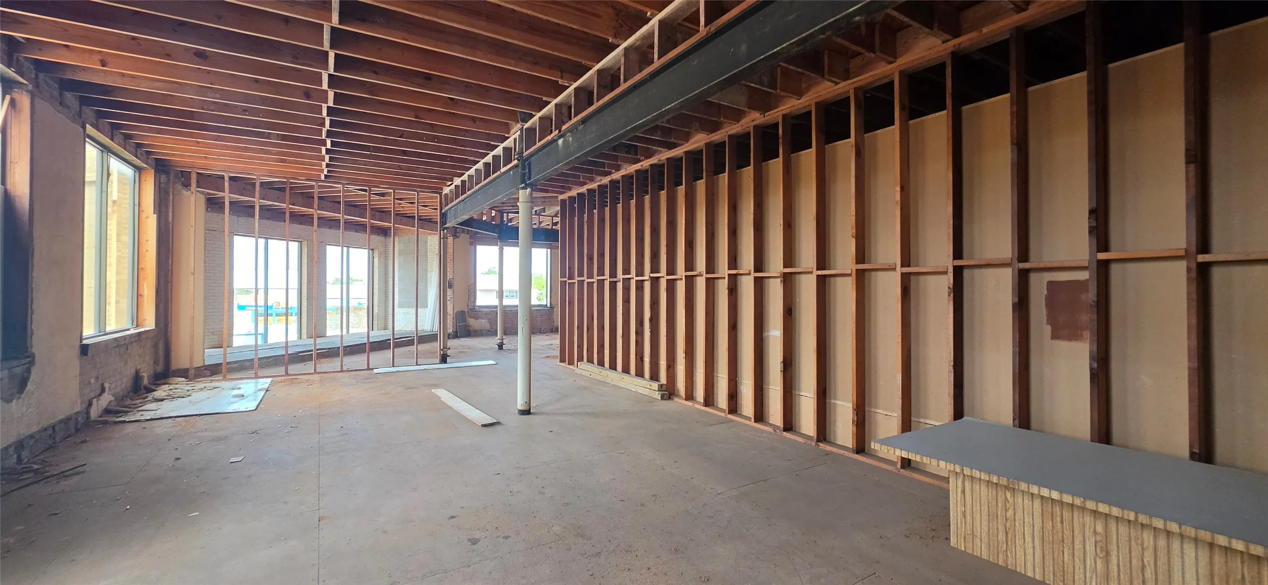 Exposed wood ceiling joists and wall framing