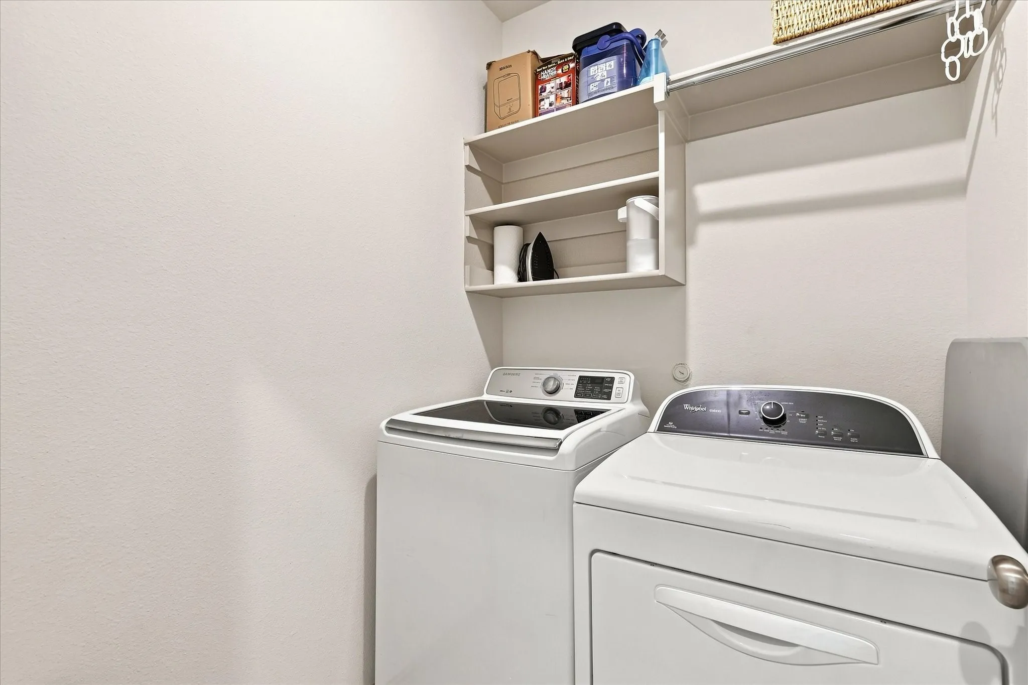 Separate walk-in laundry is located upstairs for convenient access
