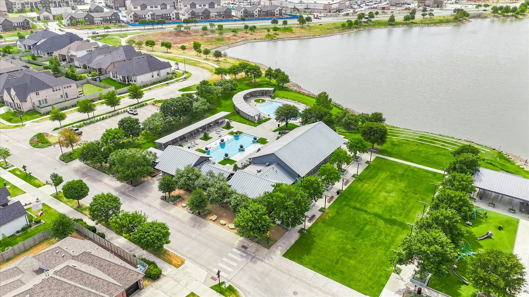 Community lake access, extensive greenspace, multiple swimming pools, community building, and covered outdoor areas