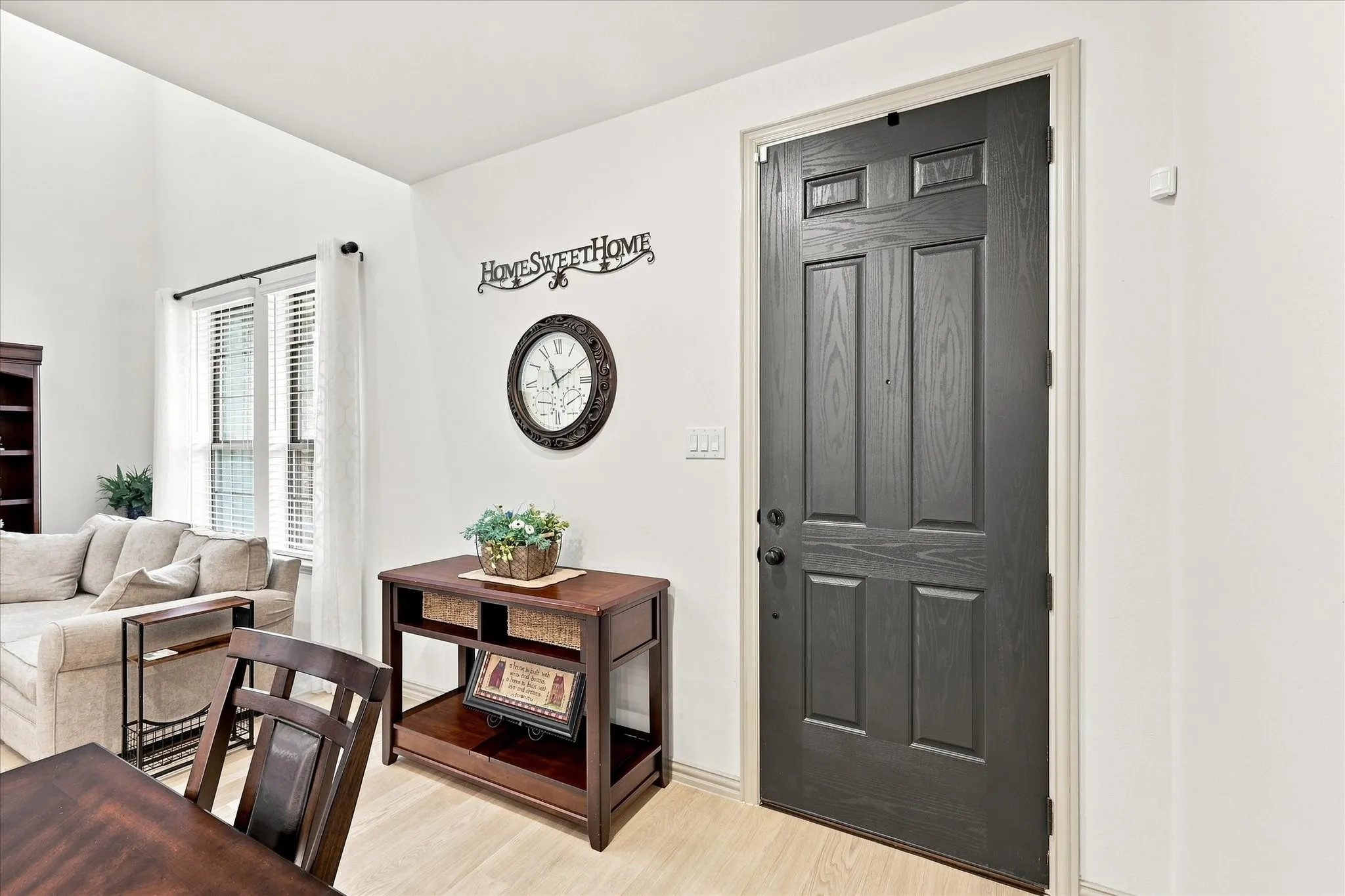 Light wood-finish flooring and vaulted ceilings