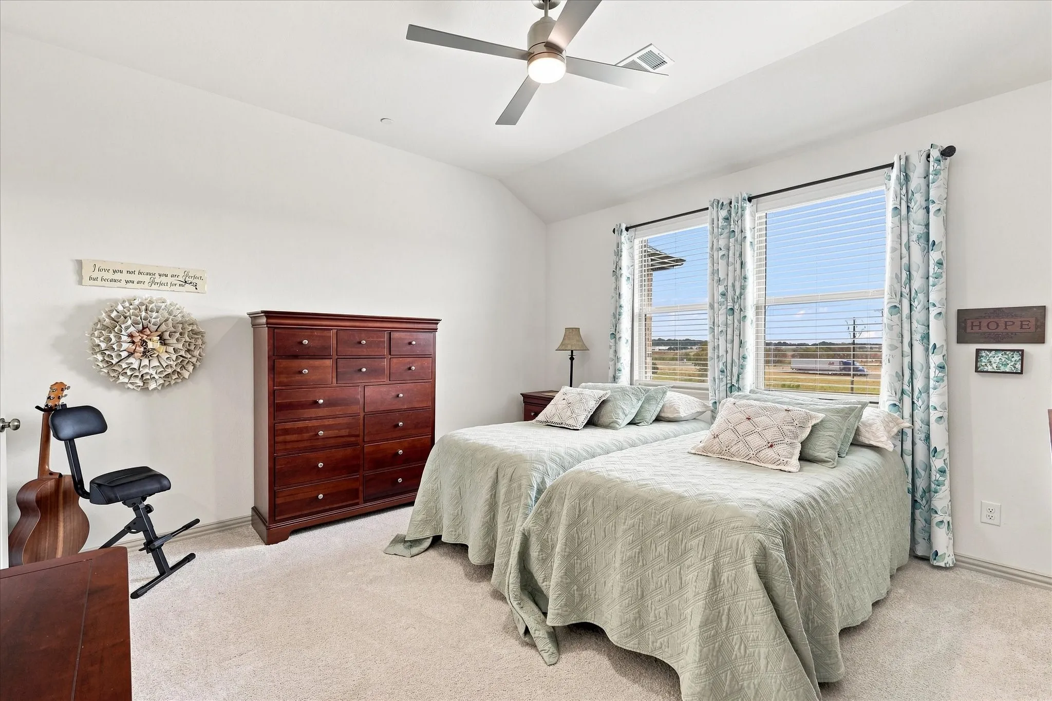 High ceilings with ceiling fan and plenty of room in this primary suite.