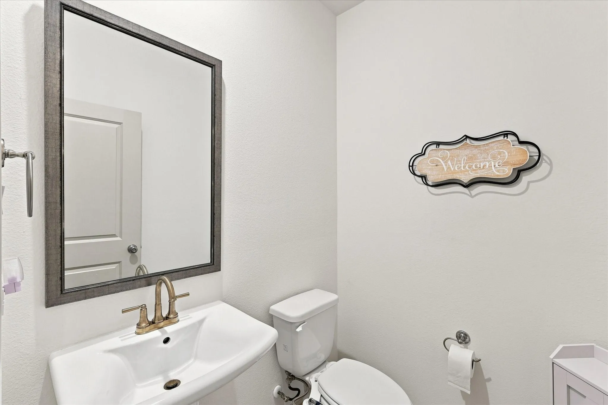 Half bath located down stairs for guests and convenience.