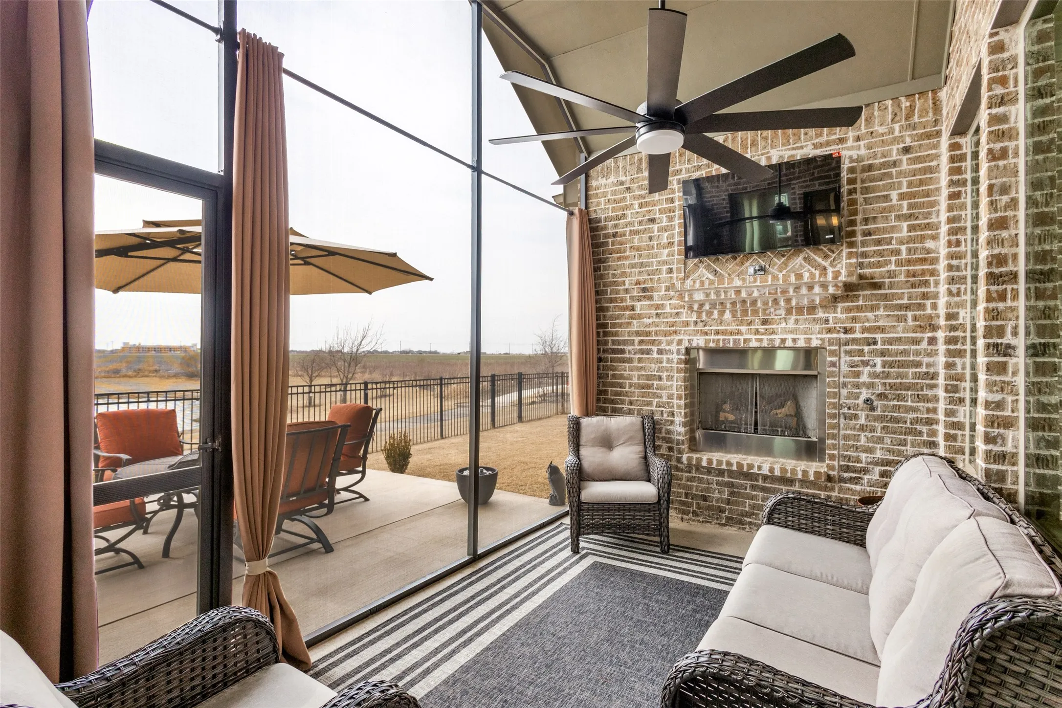 Covered patio with fireplace.