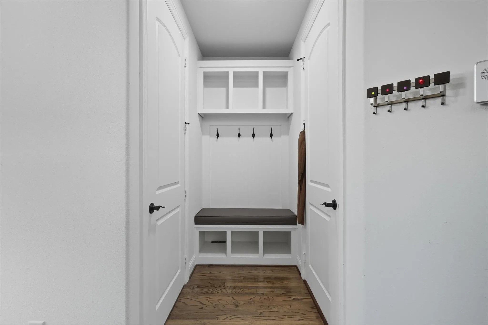 Mudroom with dark wood-type flooring