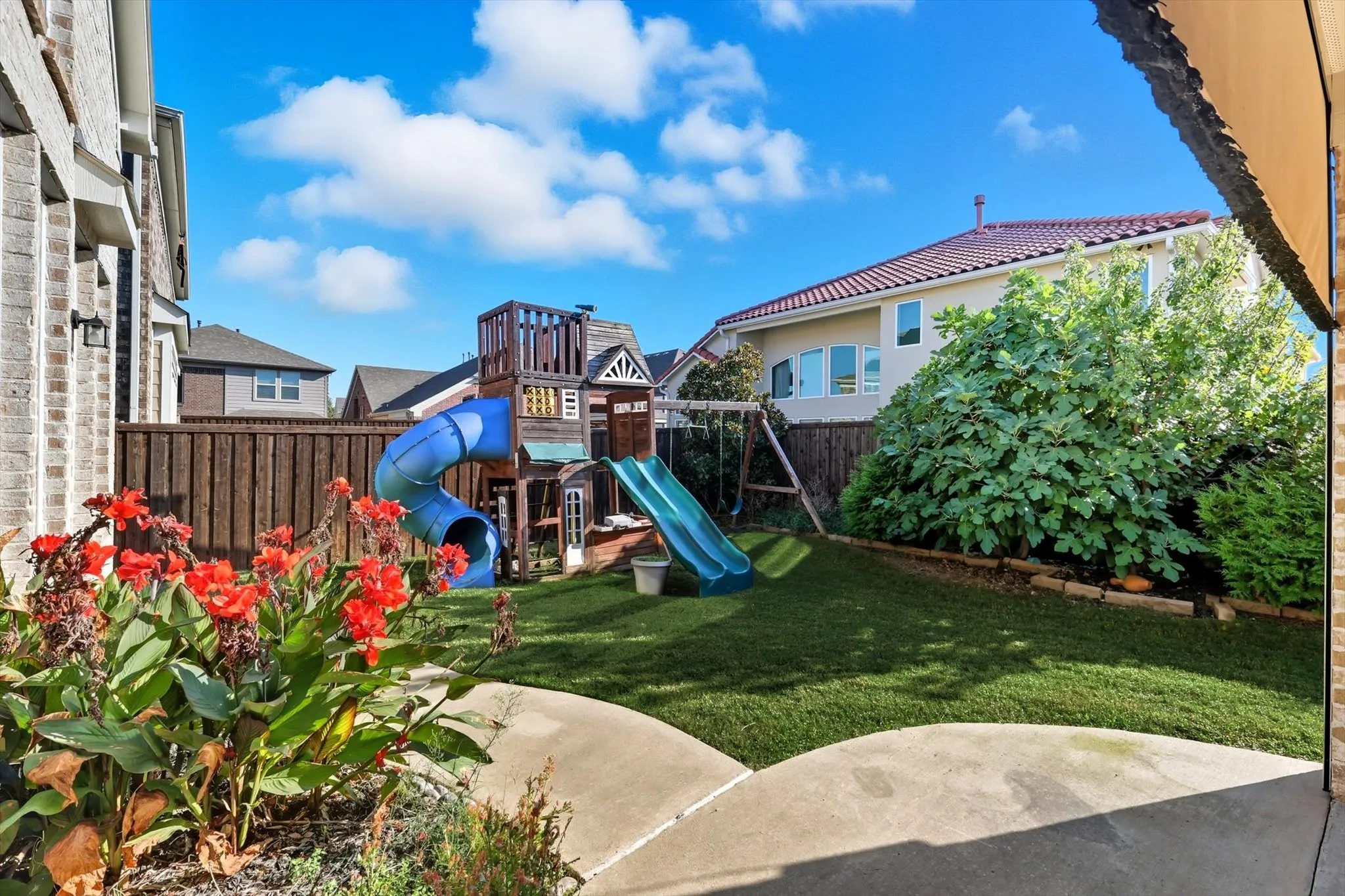 View of jungle gym featuring a fenced backyard