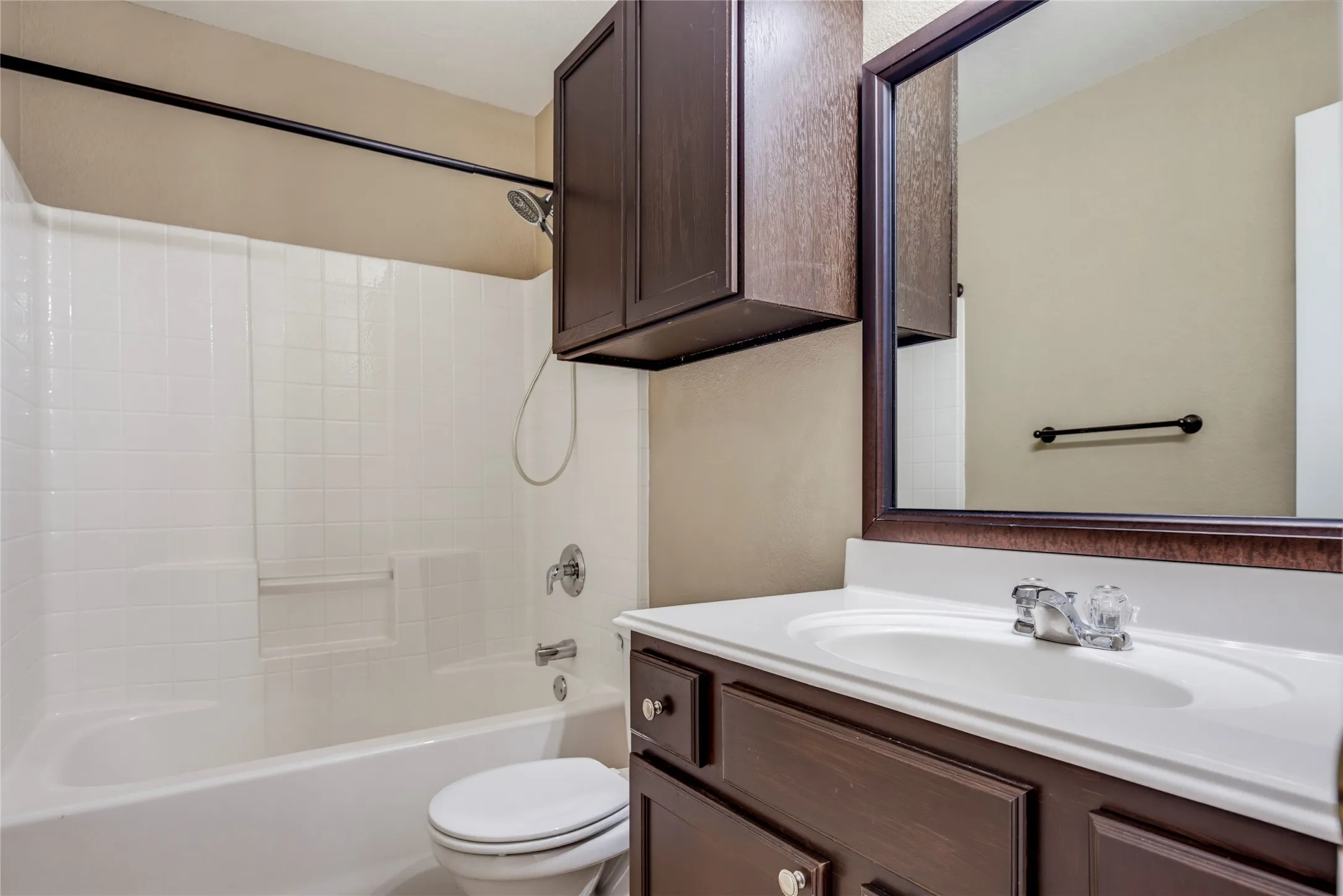 White shower/tub combination with chrome fixtures
