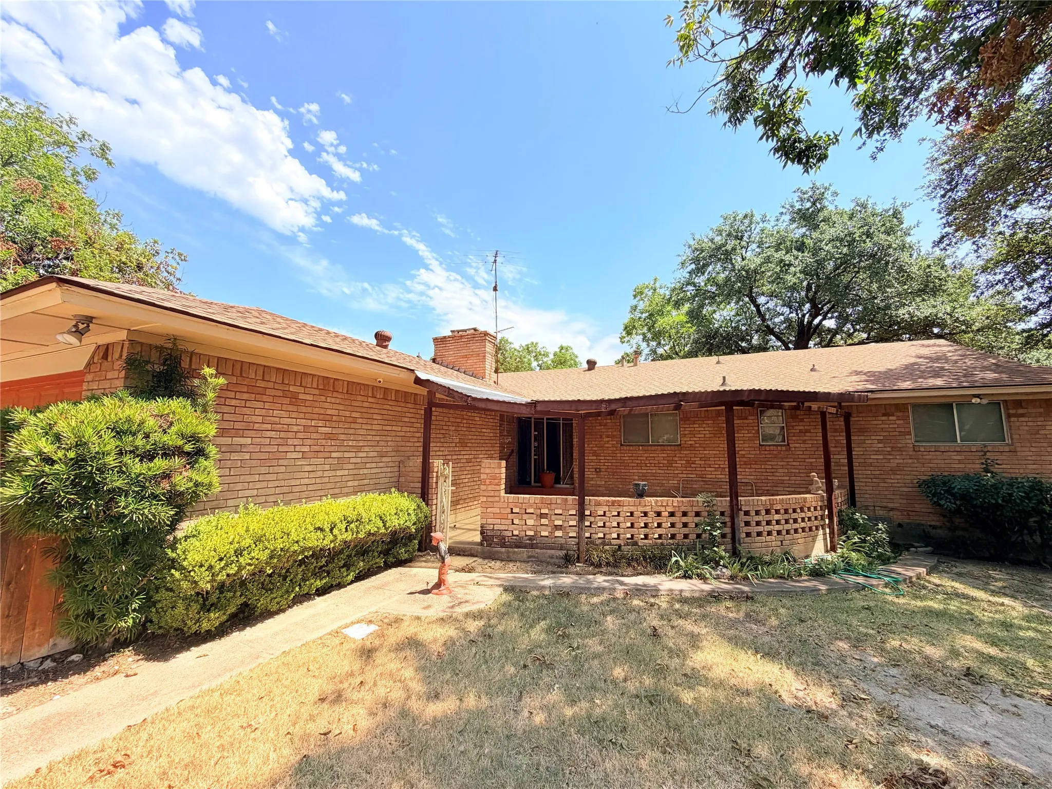 Brick exterior with an extended covered porch