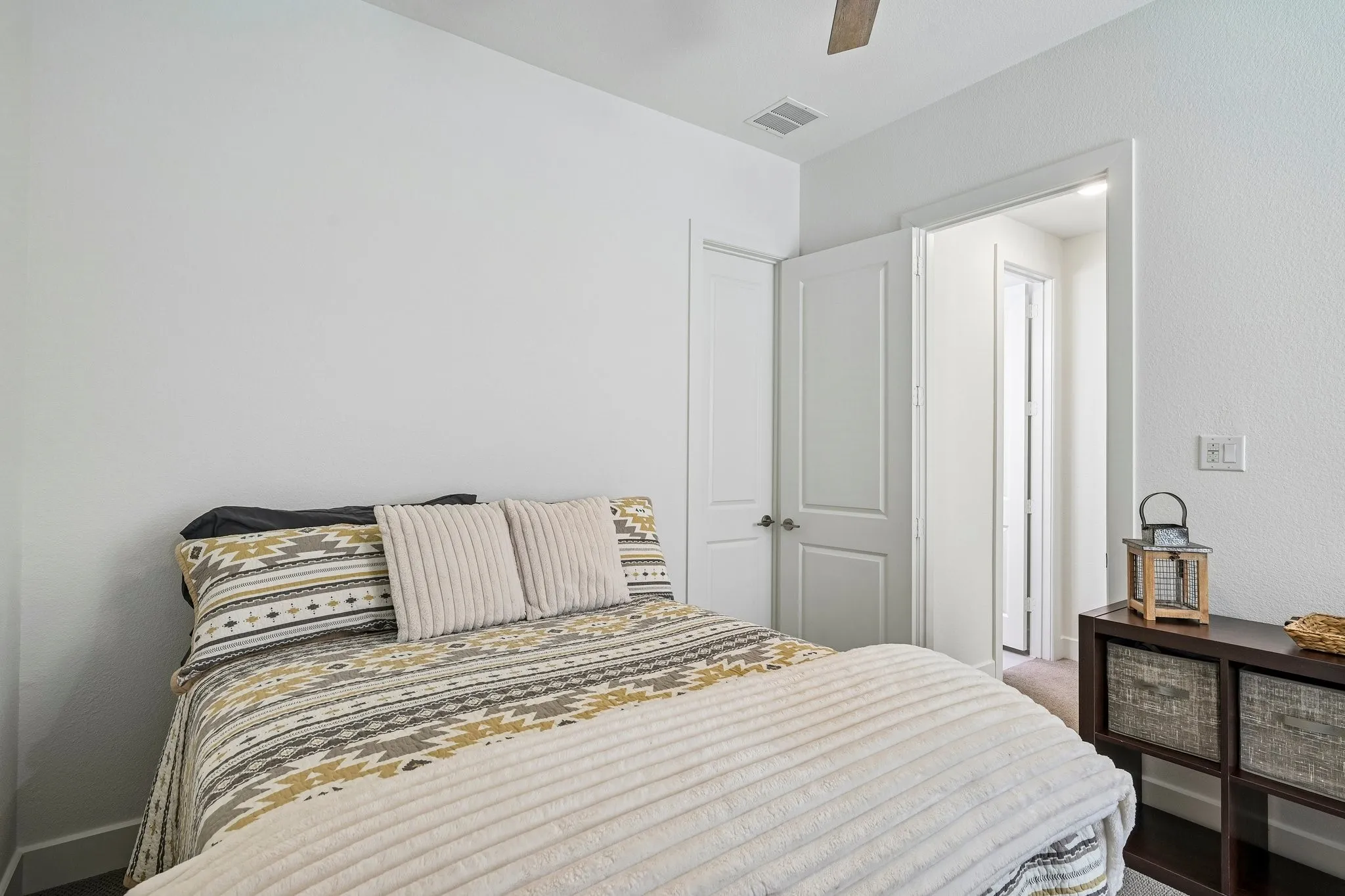 Recessed lighting, ceiling fan, solid core doors, white trim, and light-toned walls